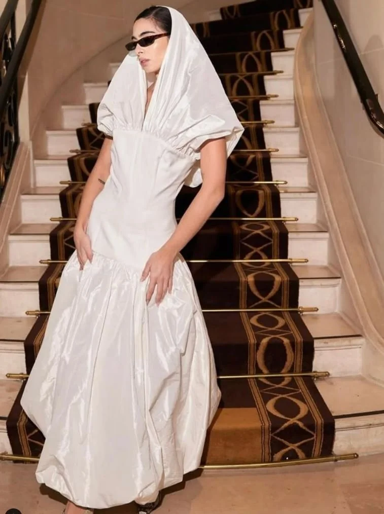 Federica Labanca in the ivory hooded gown during Paris Fashion Week