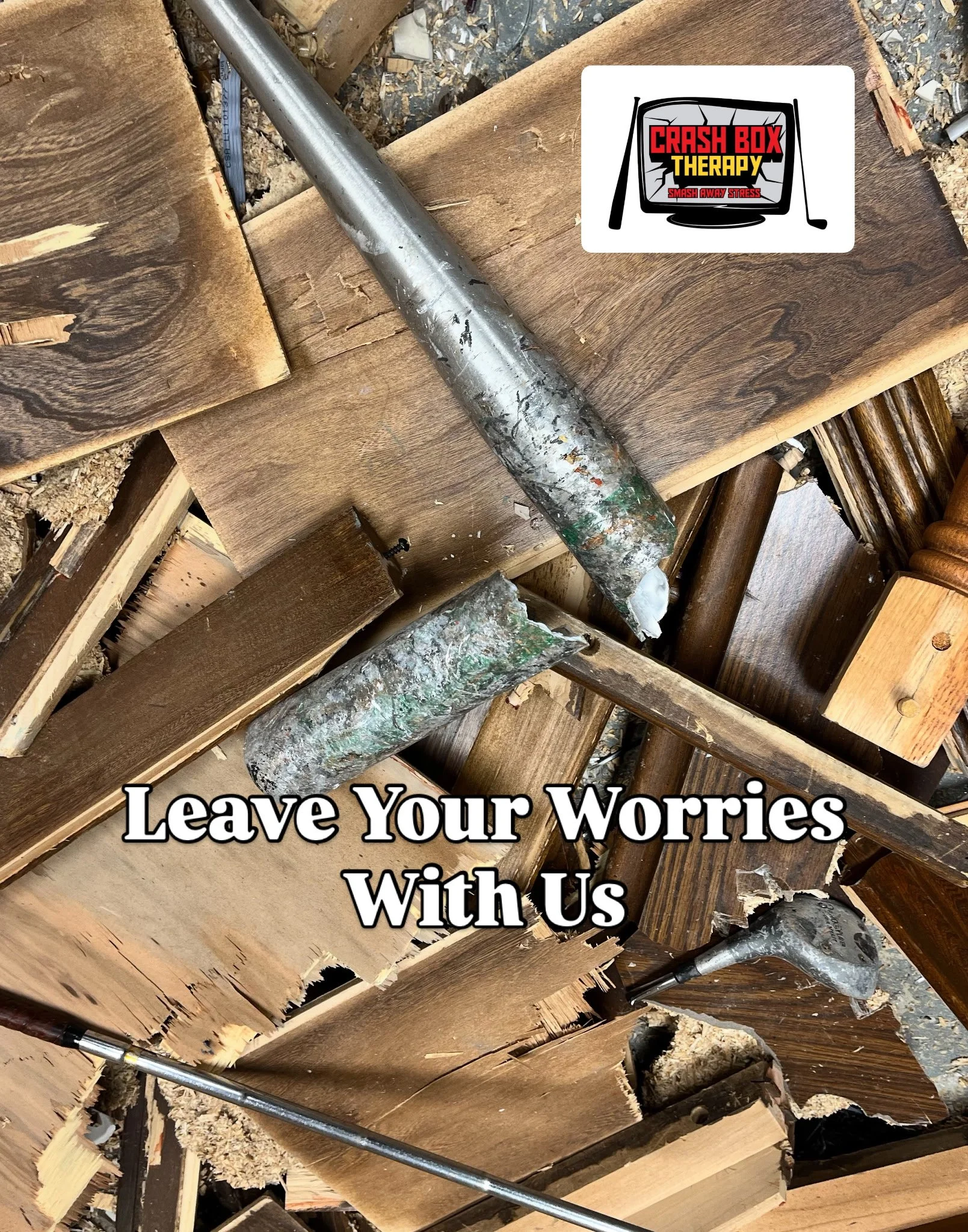 A pile of chopped wood and several woodworking tools, including chisels, with a sticker that reads 'Crash Box Therapy: Smash Away Stress' on top of the wood. The message says, 'Leave Your Worries With Us'.