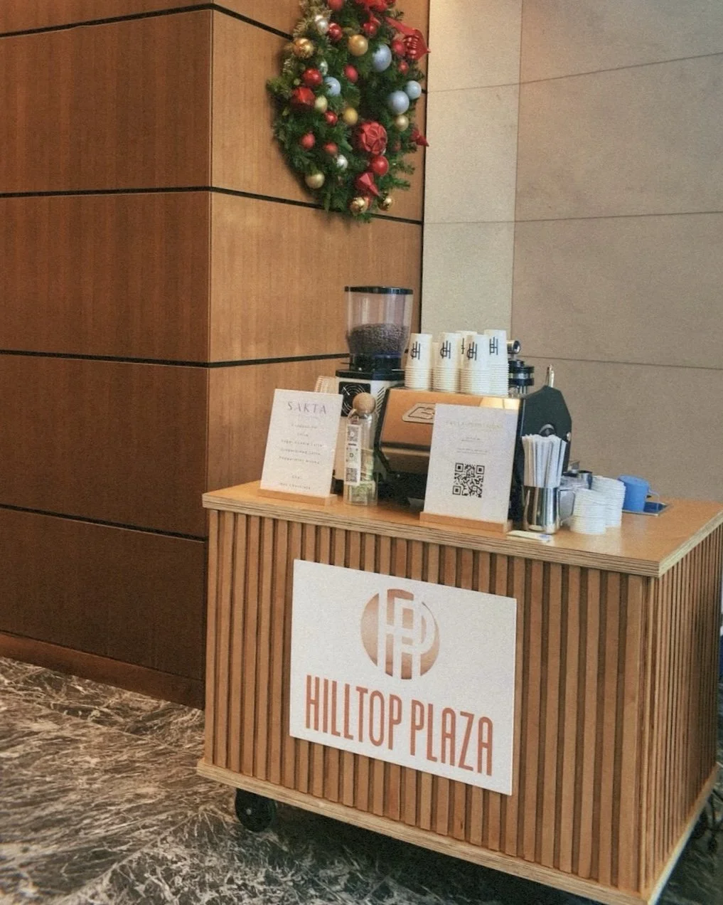 A modern custom coffee catering cart at a corporate holiday party in Austin, Texas.
