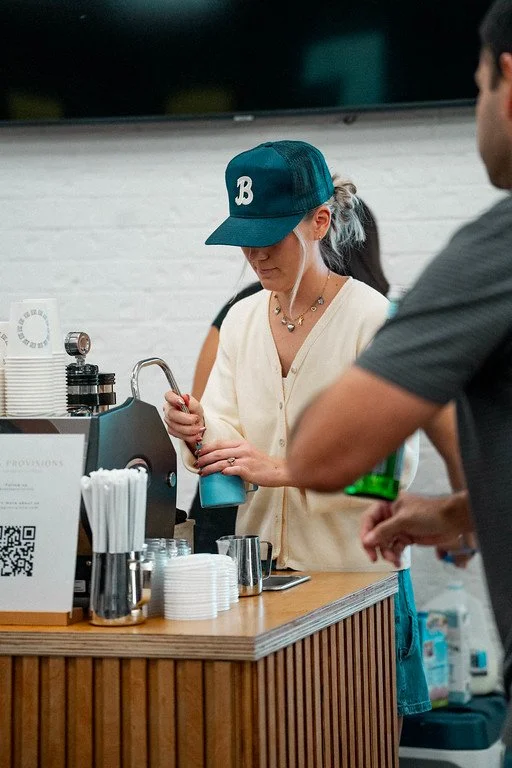 Mobile espresso bar offering coffee catering at a Dallas wedding, with baristas serving cappuccinos, lattes, and espresso drinks.