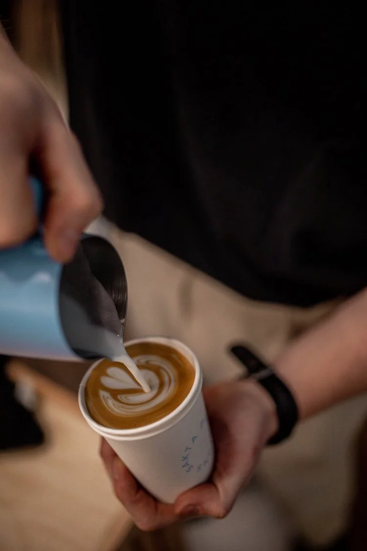 Mobile Espresso bar barista preparing custom drinks for a corporate event with latte art