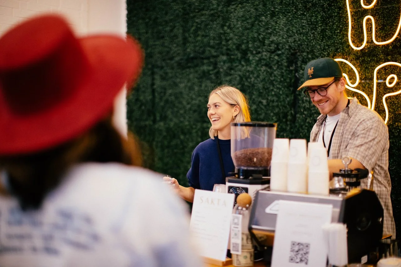 Elegant espresso bar setup for a private event in Dallas, with professional baristas serving cappuccinos and lattes.