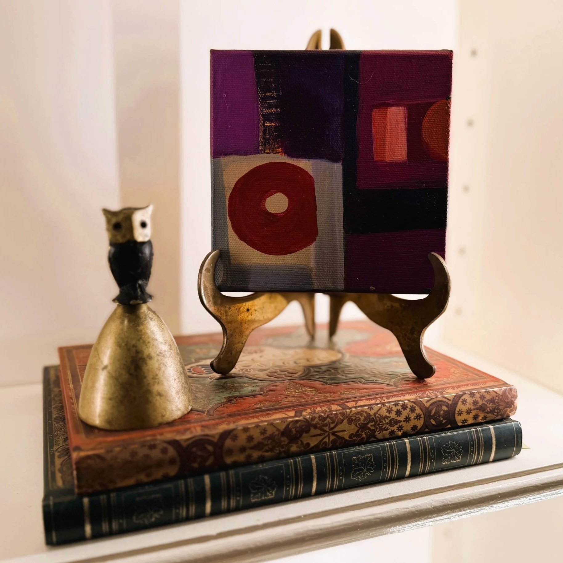 Stacked books and art