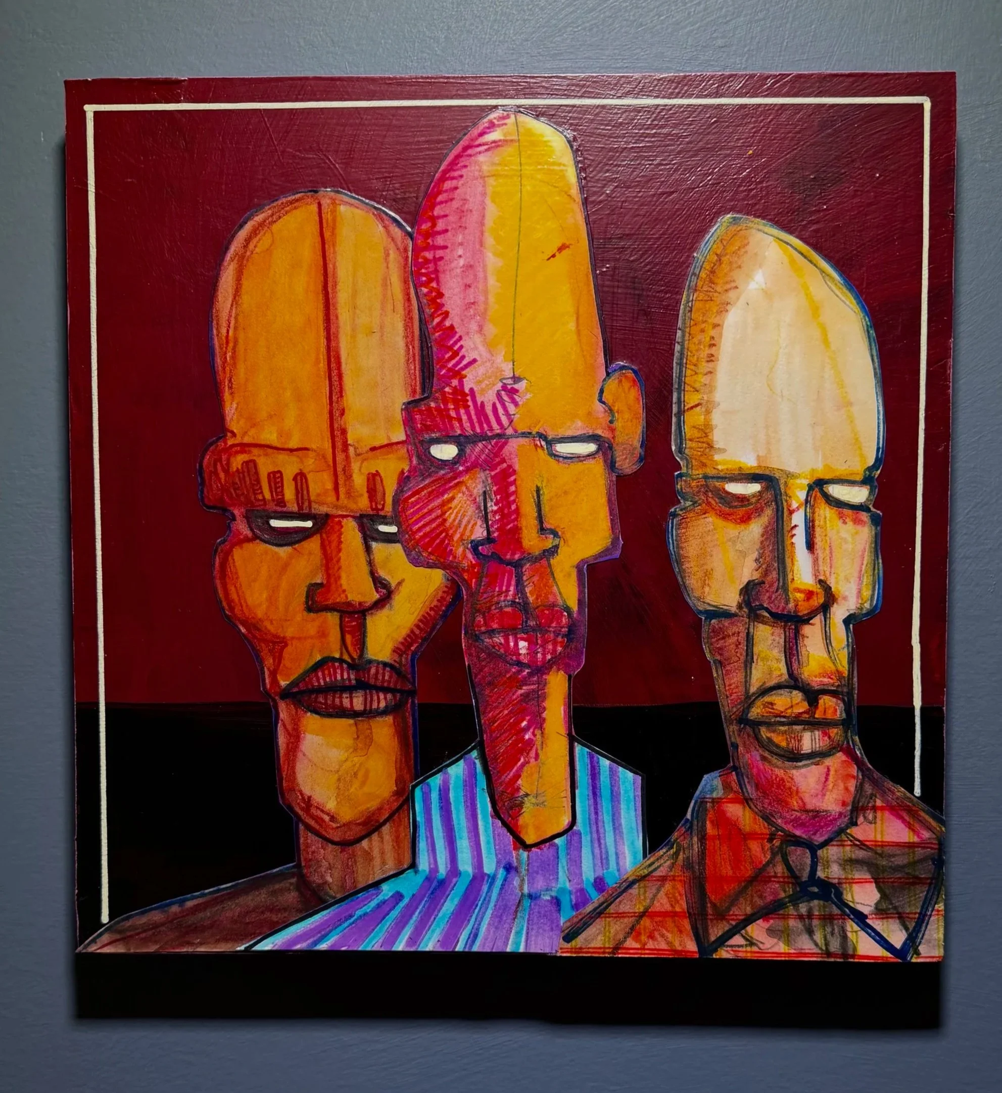 Colorful abstract painting of three large human profiles in orange, yellow, and pale yellow, overlapping each other with a textured red background and intricate lines and patterns.