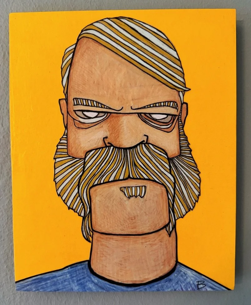 A cartoon-style portrait of a man with a serious expression, long striped hair, thick mustache, and beard. The background is bright yellow, and he is wearing a blue shirt.