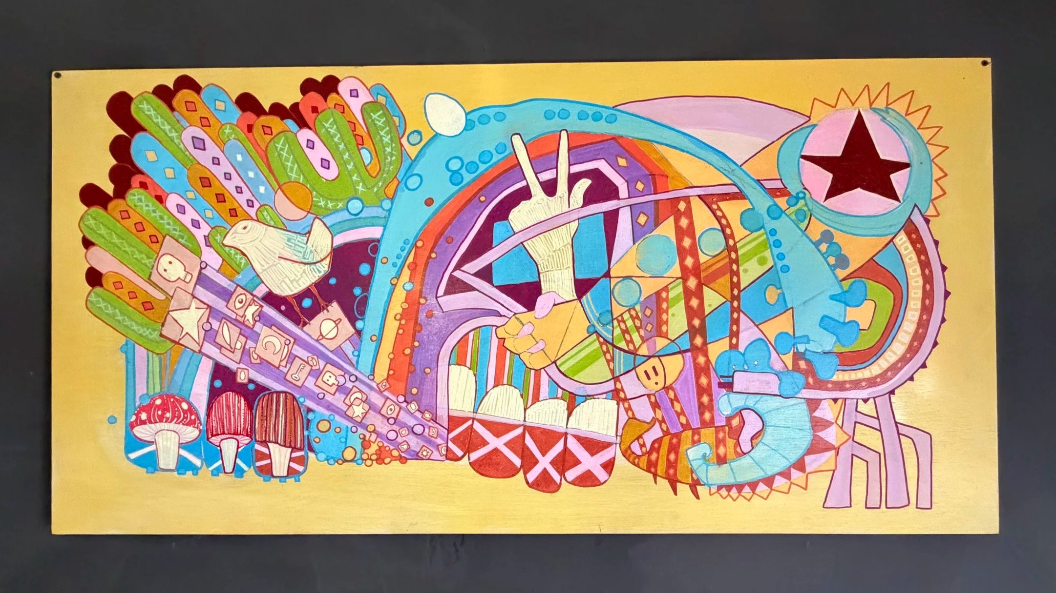 Colorful abstract artwork featuring various shapes, patterns, and symbols including mushrooms, stars, and electronic icons, set against a yellow background.