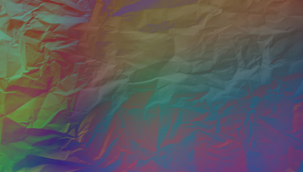 Abstract rainbow-colored crumpled paper texture.