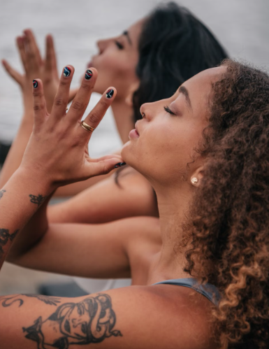 Adult practicing body awareness while learning how the nervous system responds to anxiety.