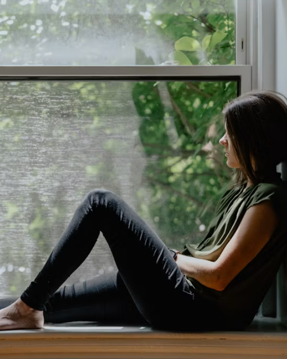 Adult reflecting on anxiety and understanding why insight alone may not stop physical reactions.