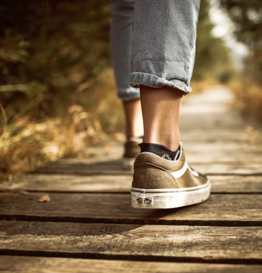 Adult slowing down and noticing physical anxiety before deciding how to respond.