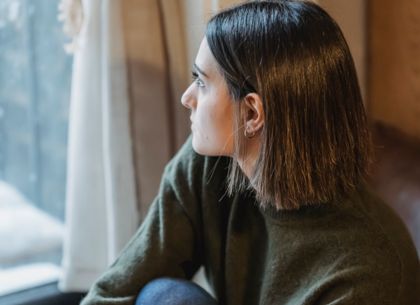 Adult reflecting calmly while learning to distinguish relationship anxiety from genuine concerns.