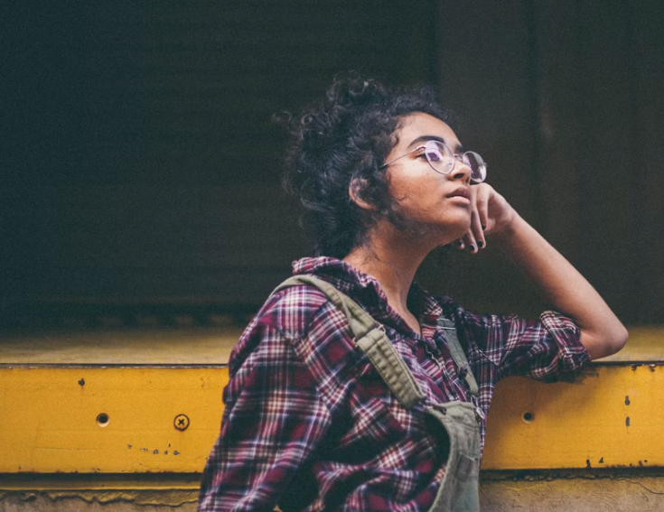 Adult reflecting on anxious thoughts and overthinking patterns in relationships.