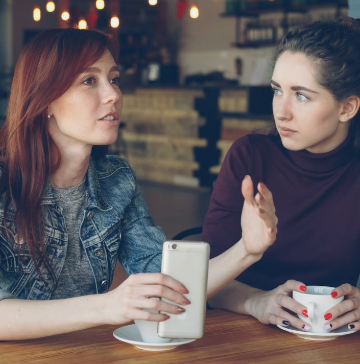 Two adults having a respectful disagreement while practicing healthy communication and accountability.