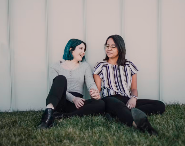 LGBTQIA+ adults spending time together in a supportive and affirming environment.