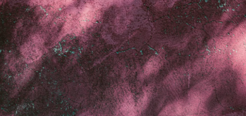 Abstract plum and teal textured background.