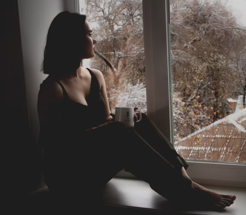 Adult noticing physical symptoms of anxiety even when nothing appears to be wrong.