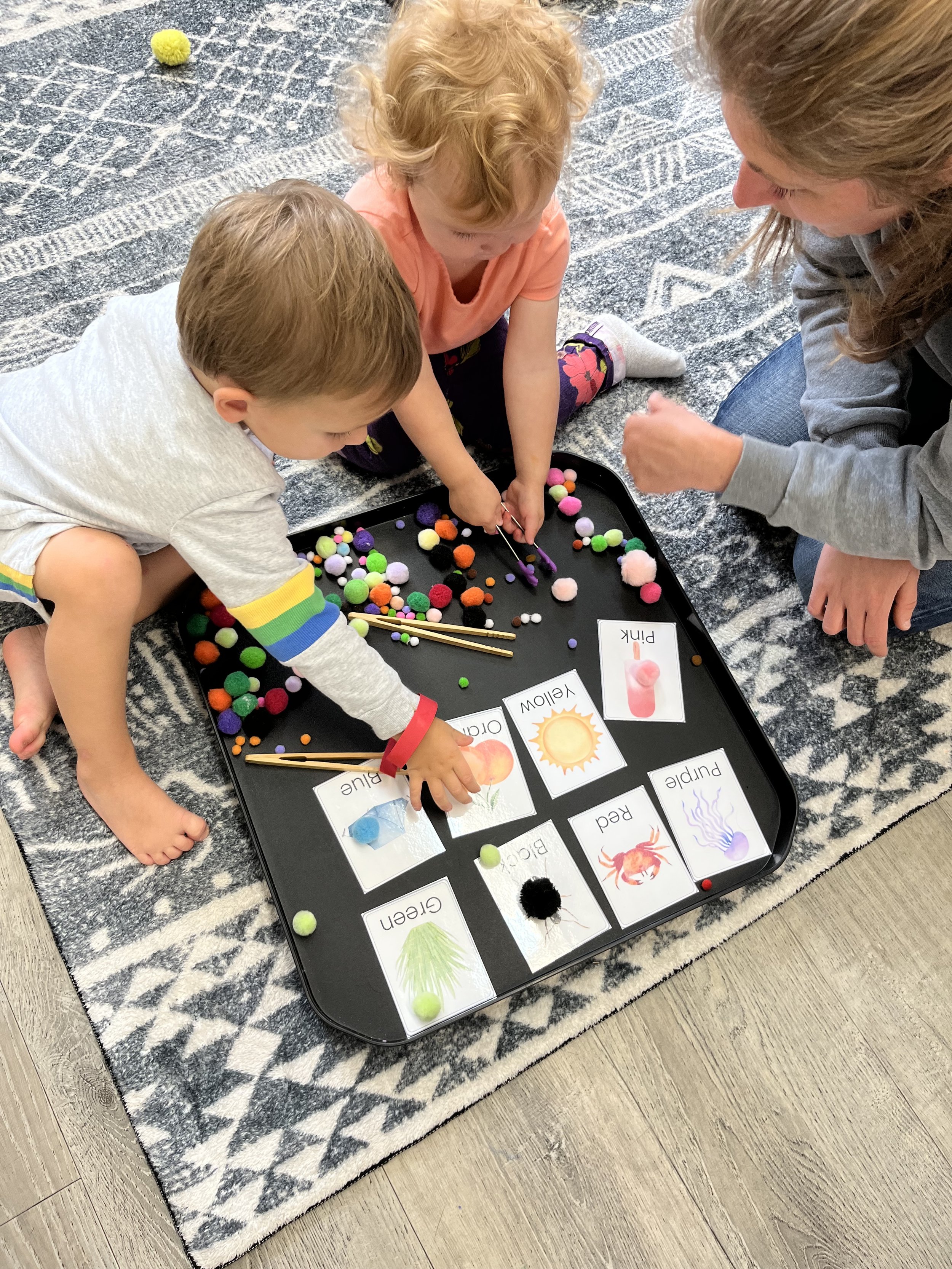 two preschool kids learning at the learning hive