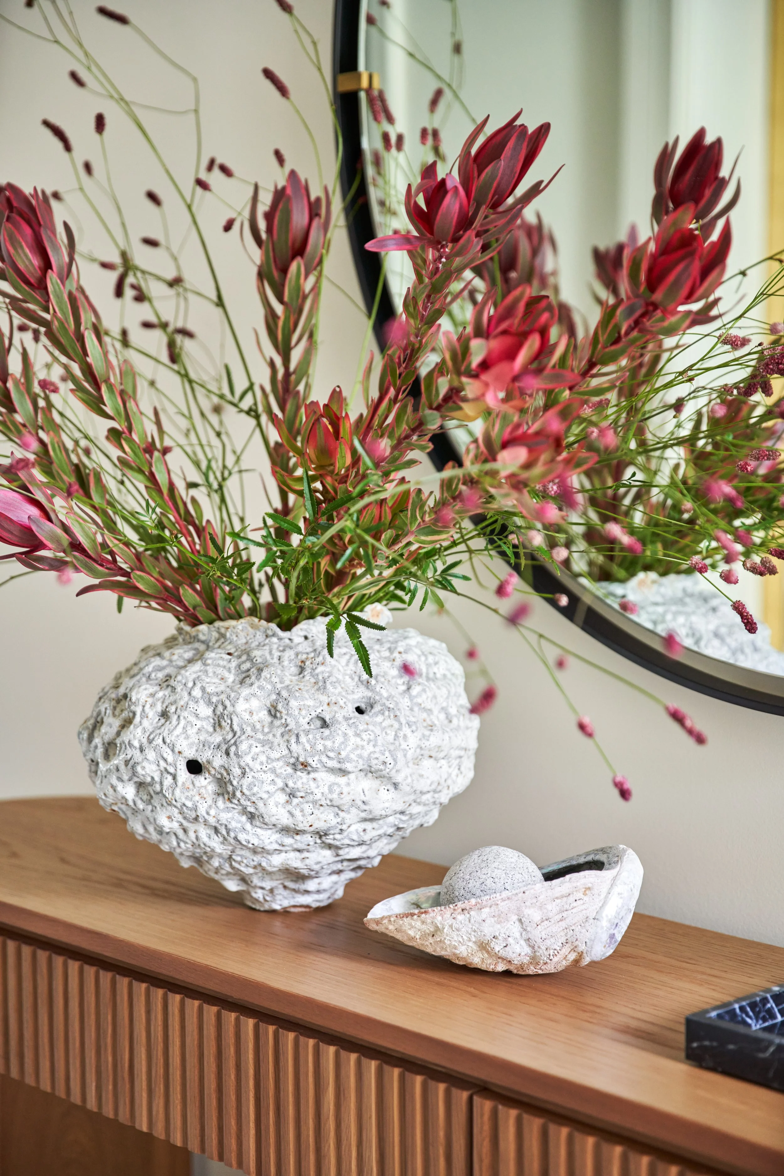 A striking marble fireplace in this San Francisco living room by Retiro Design Co evokes quiet luxury. 