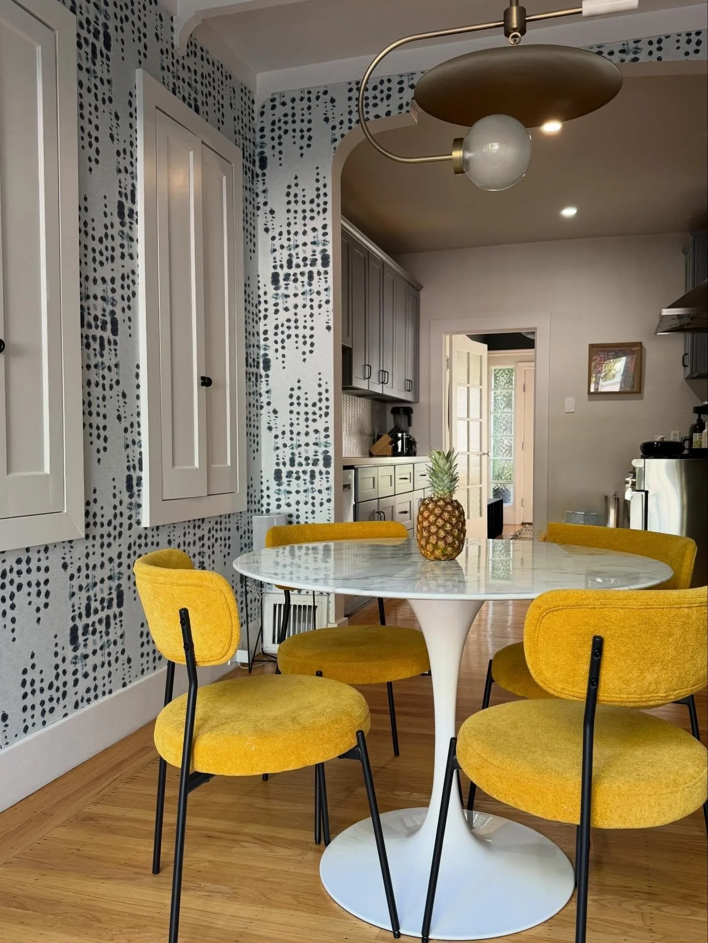 We infused some personality into this mid century breakfast nook and kitchen with bold blues + yellow, statement wallpaper and a sculptural light fixture to boot. 

Design | @retirodesign.co 

#iphonepics
#breakfastnook 
#midcenturydesign 
#sanfranci