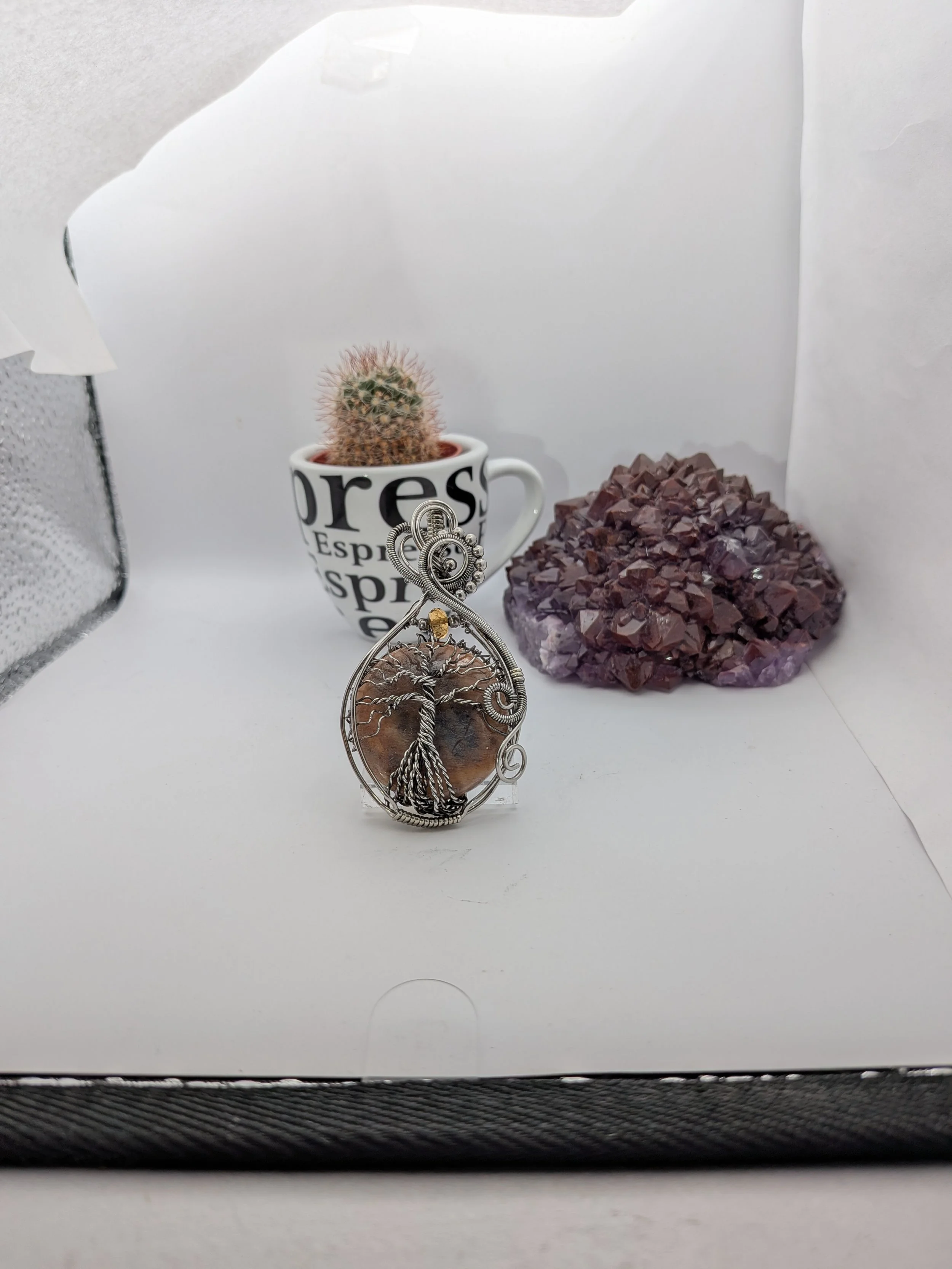 This captivating, stainless wire Black Moonstone tree of life pendant draws you into a stunning forest. Featuring a clean background, this piece offers a beautiful, detailed view on both sides.