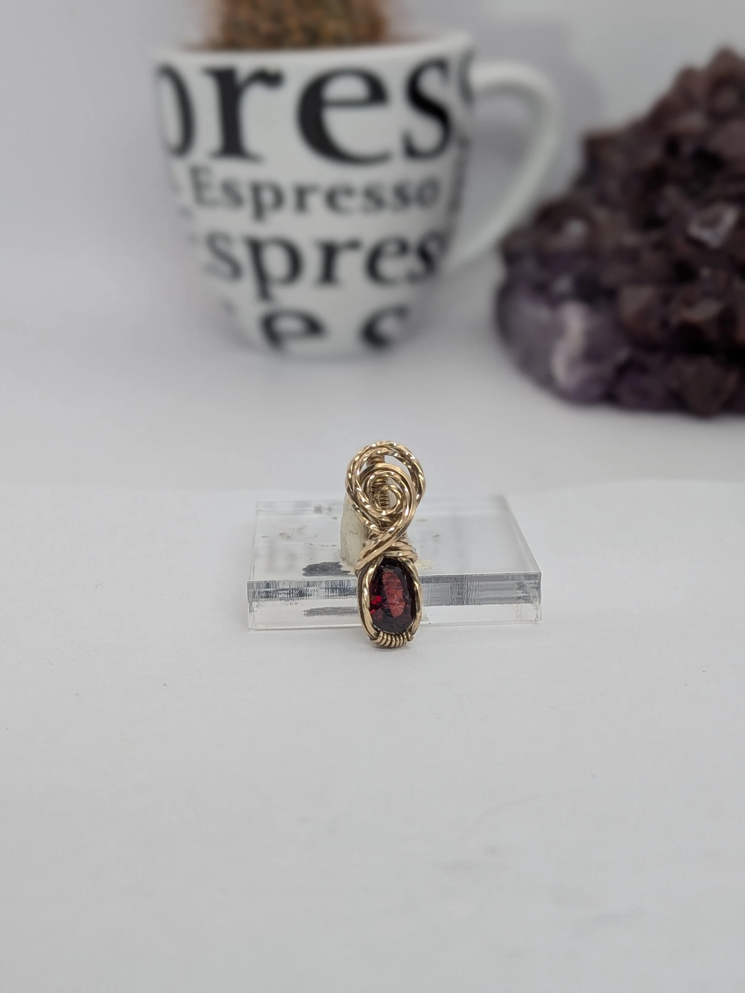 Gorgeous petite gemstone pendant, intricately wire-wrapped and accented with a heart-style bail, beautifully highlighting the stone as the centrepiece.