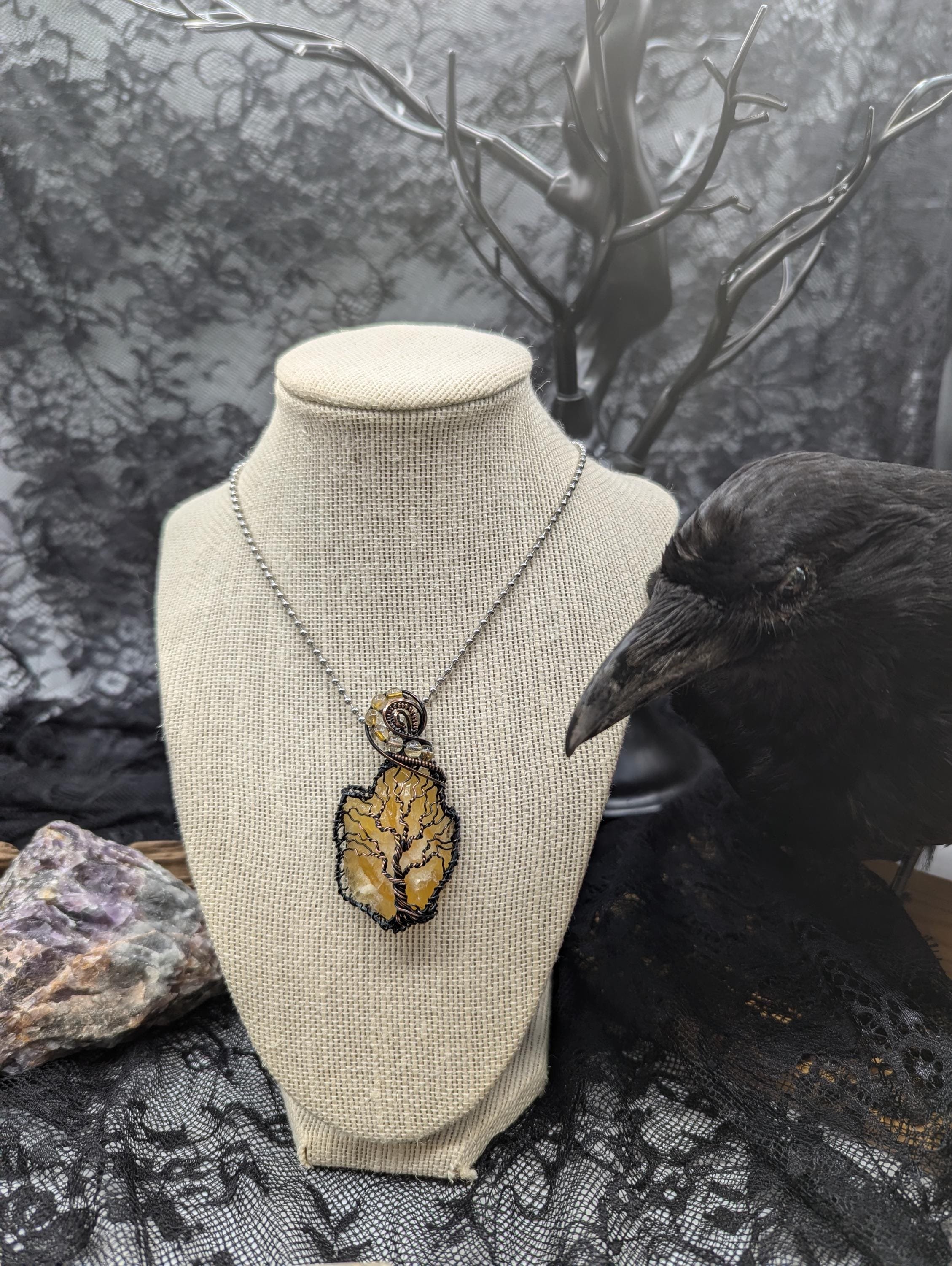 Stunning Raw Golden Yellow Calcite pendant, elegantly wrapped in copper wire with a beautiful Tree of Life design. Adorned with flowing Rutile quartz accent beads for added charm.