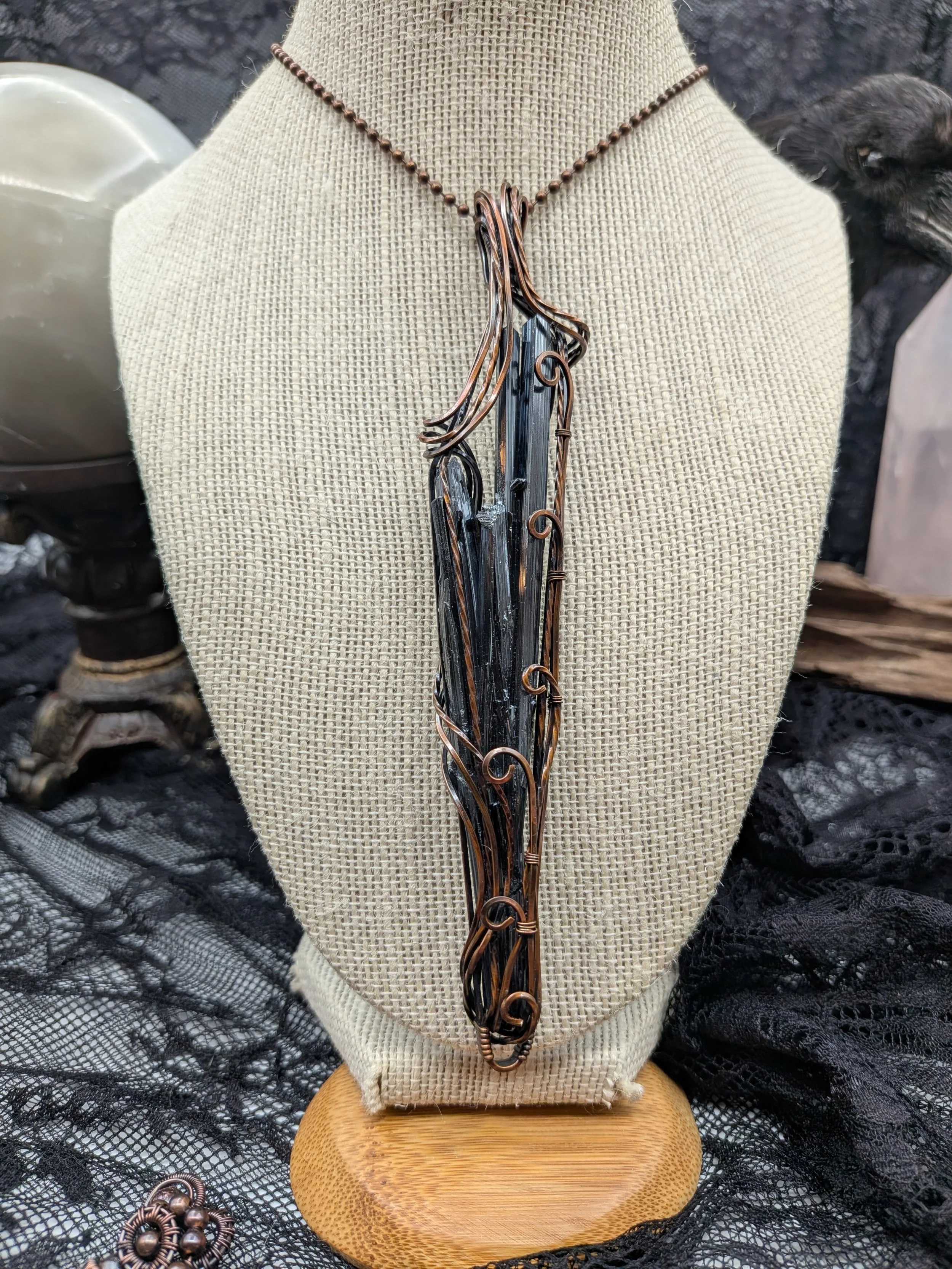 Stibnite Antimonite Solid Copper Wire Wrap Pendant that is Elegantly wrapped in twisted wire flowing down both sides drawing your eyes to the stibnite as the focal point of the pendant