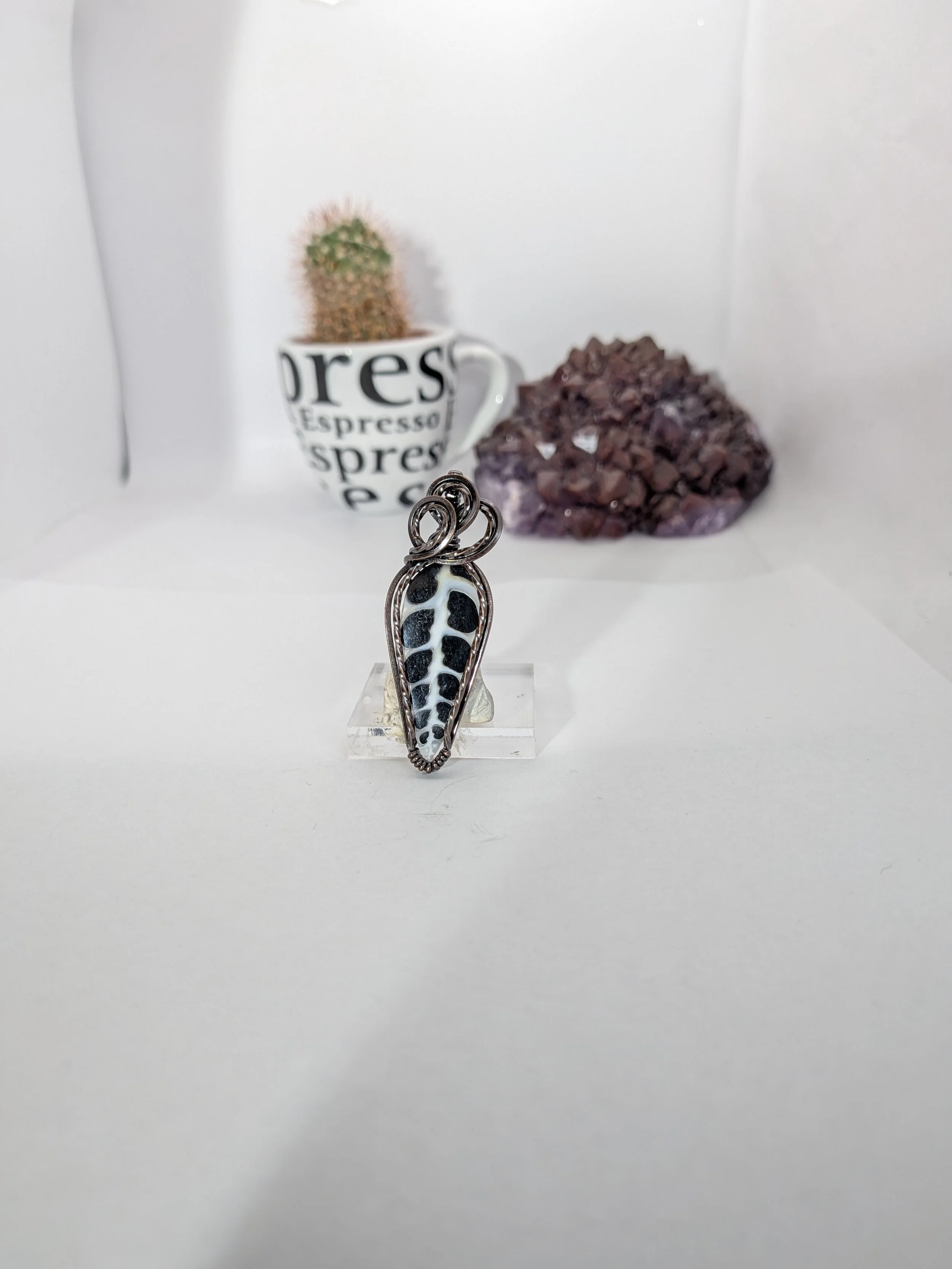 Gorgeous petite gemstone pendant, intricately wire-wrapped and accented with a heart-style bail, beautifully highlighting the stone as the centrepiece.