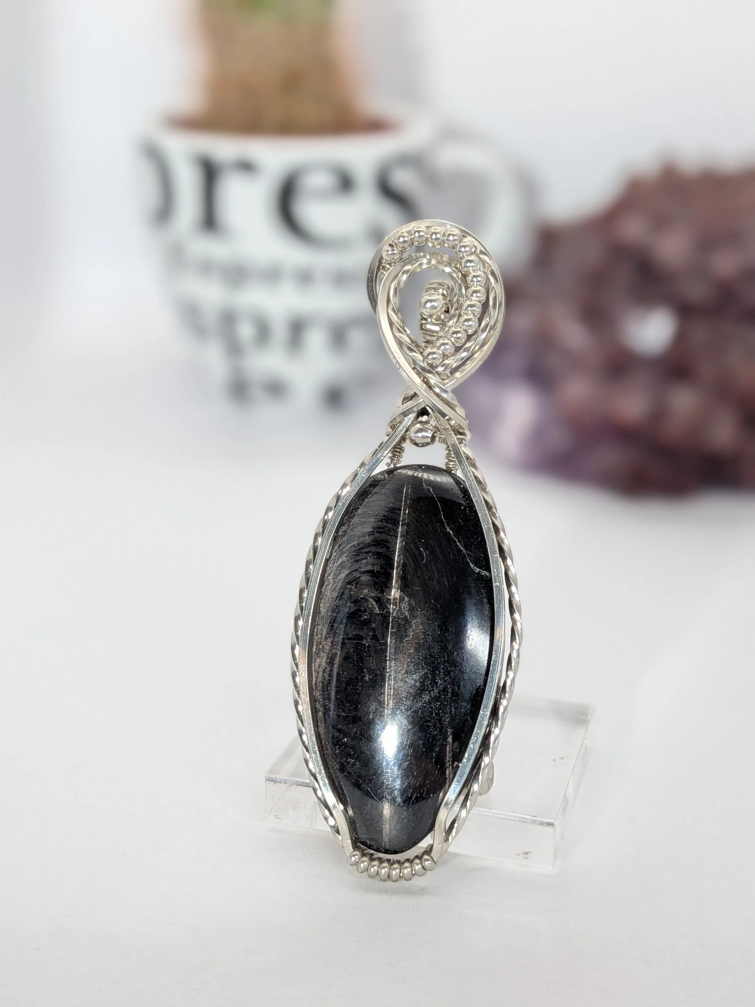 Gorgeous petite gemstone pendant, intricately wire-wrapped and accented with a heart-style bail, beautifully highlighting the stone as the centrepiece.