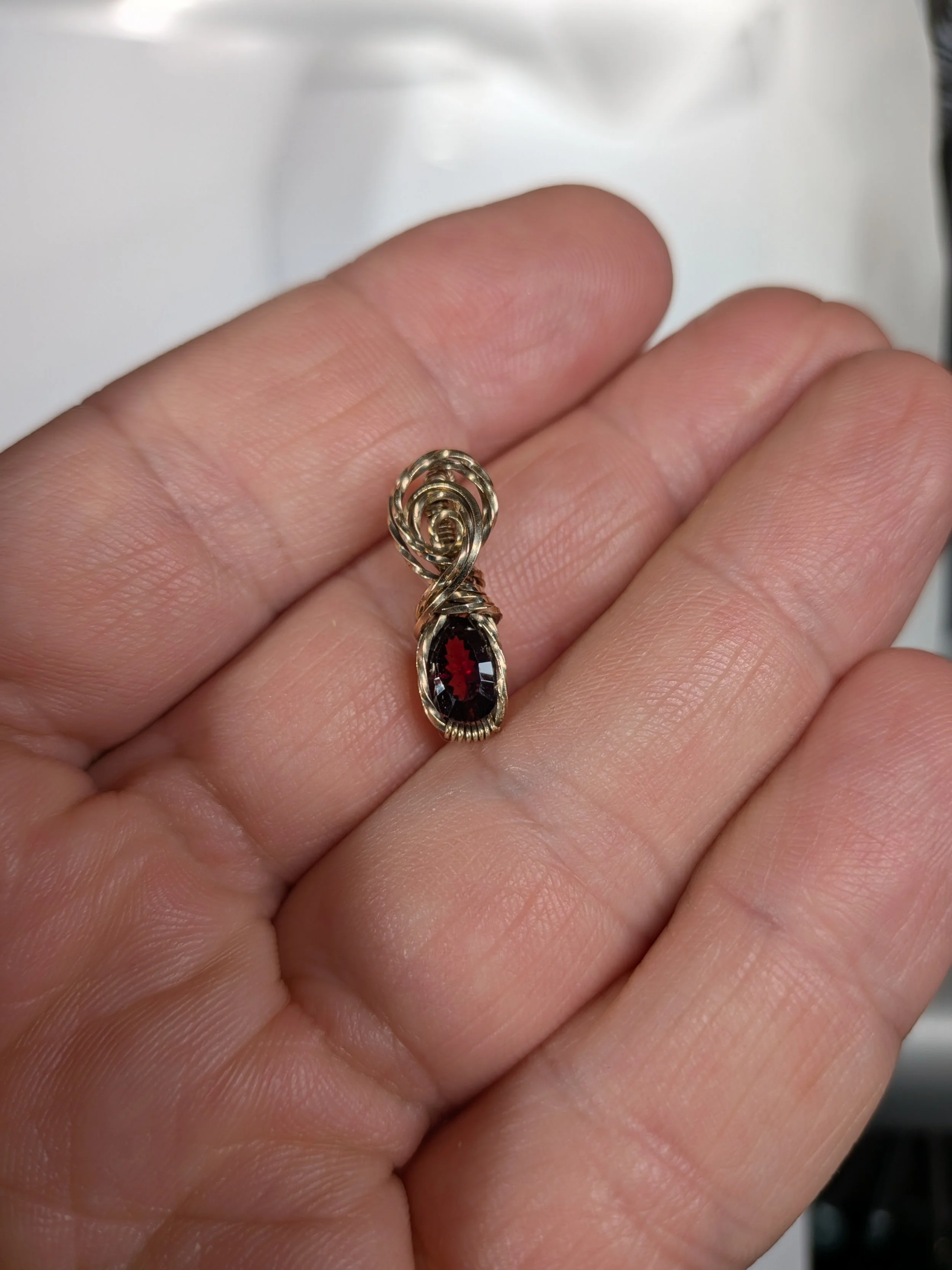 Gorgeous petite gemstone pendant, intricately wire-wrapped and accented with a heart-style bail, beautifully highlighting the stone as the centrepiece.