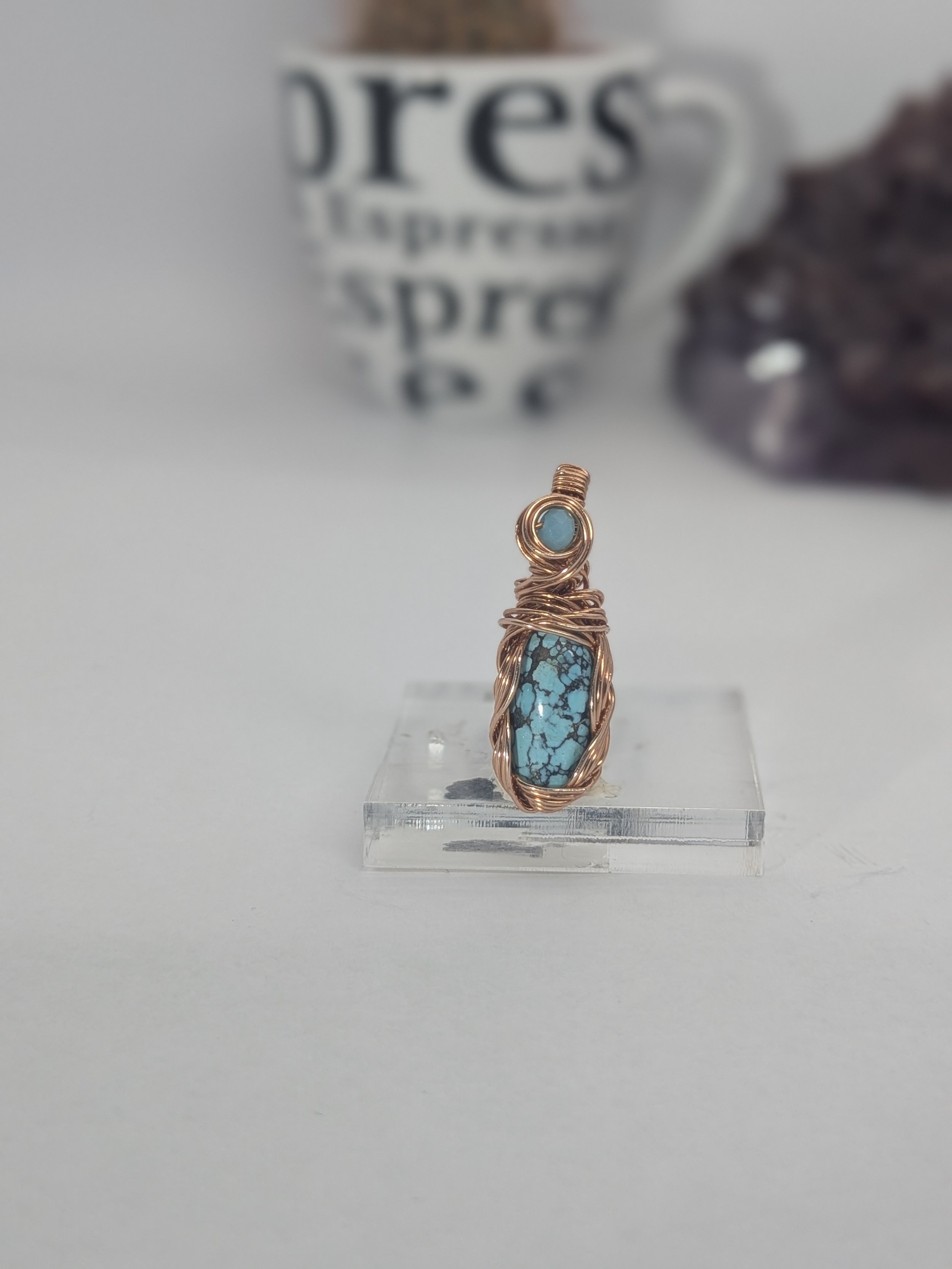 Gorgeous petite gemstone pendant, intricately wire-wrapped and accented with a heart-style bail, beautifully highlighting the stone as the centrepiece.