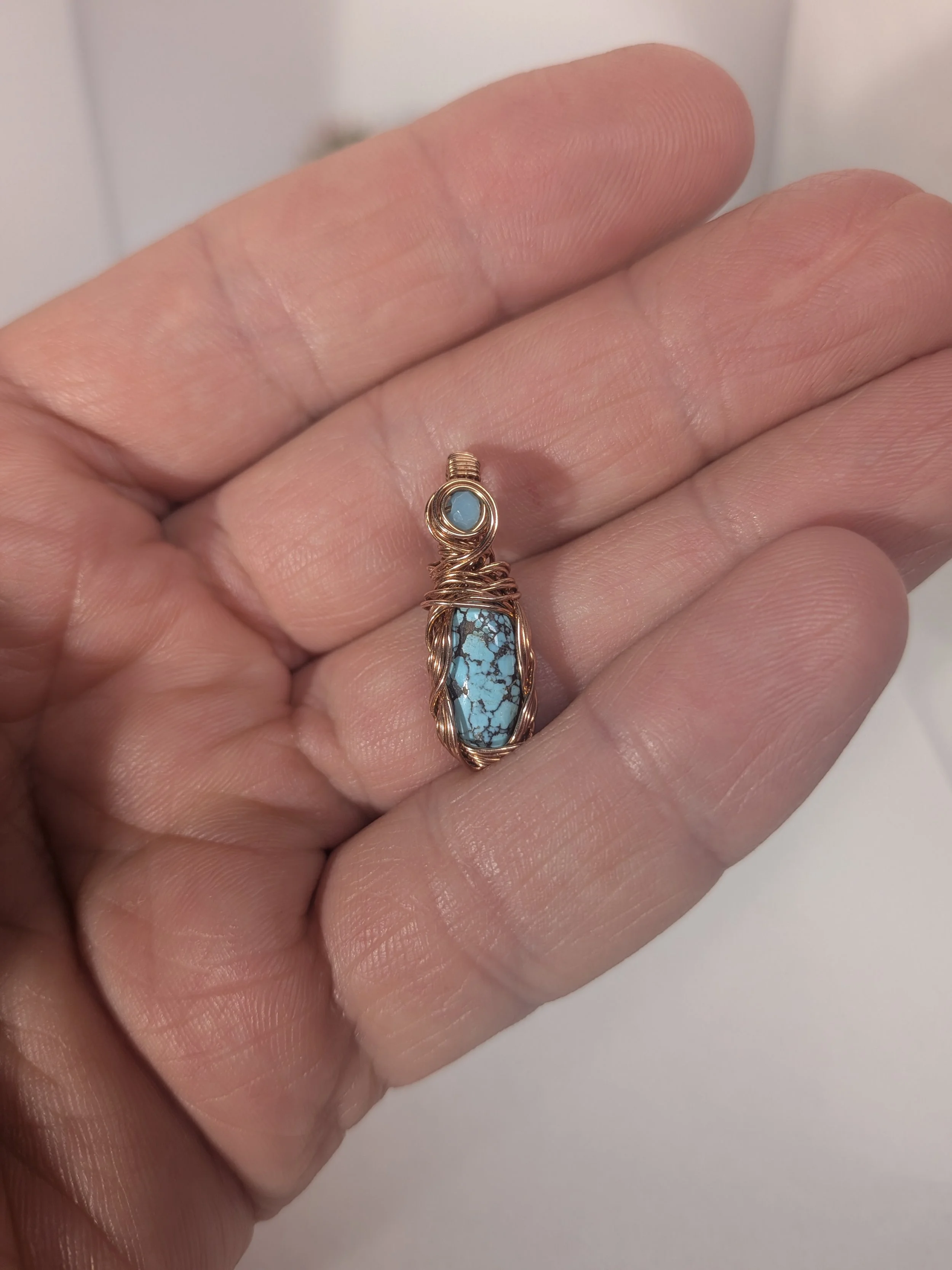 Gorgeous petite gemstone pendant, intricately wire-wrapped and accented with a heart-style bail, beautifully highlighting the stone as the centrepiece.