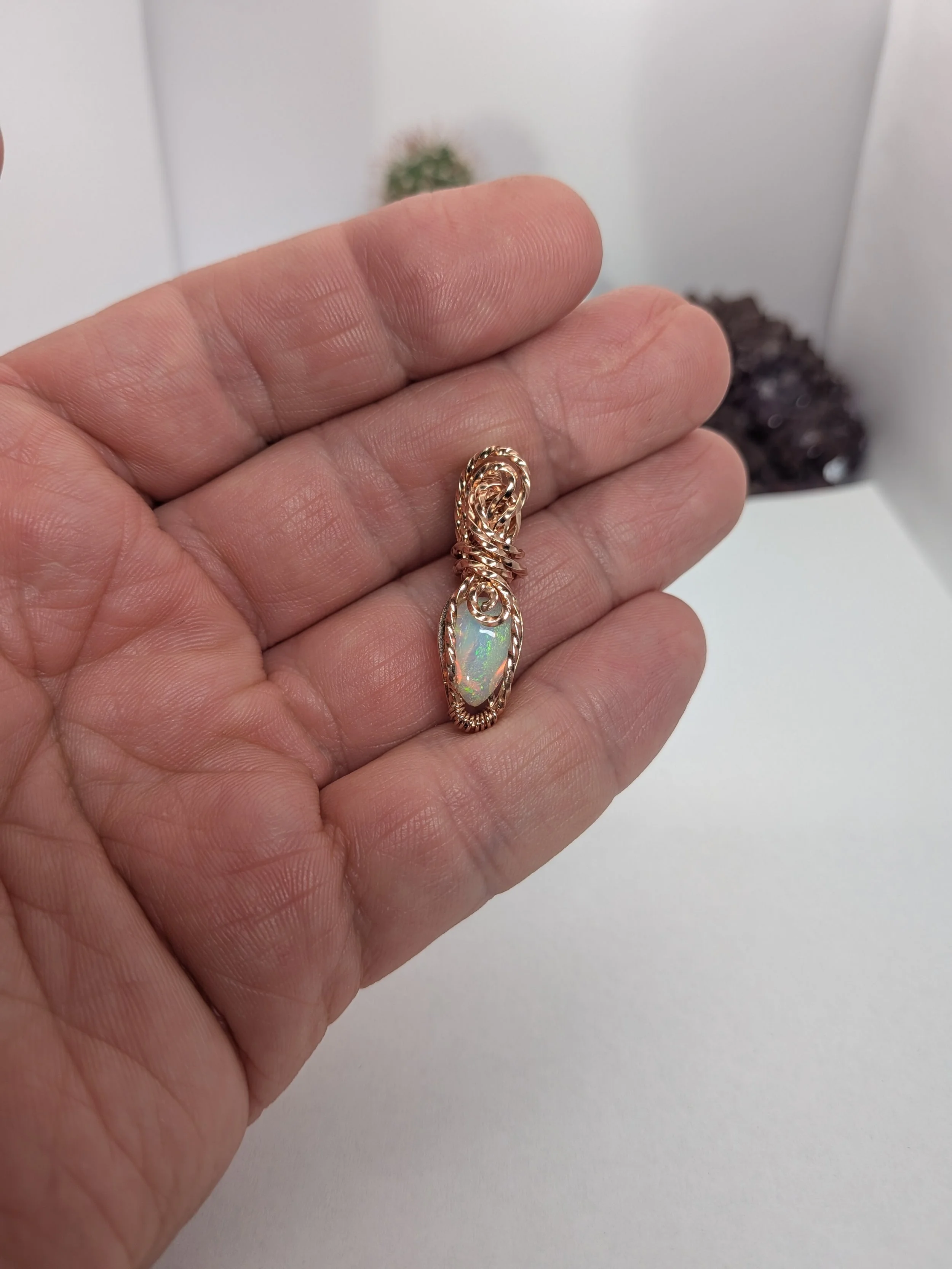 Gorgeous petite gemstone pendant, intricately wire-wrapped and accented with a heart-style bail, beautifully highlighting the stone as the centrepiece.