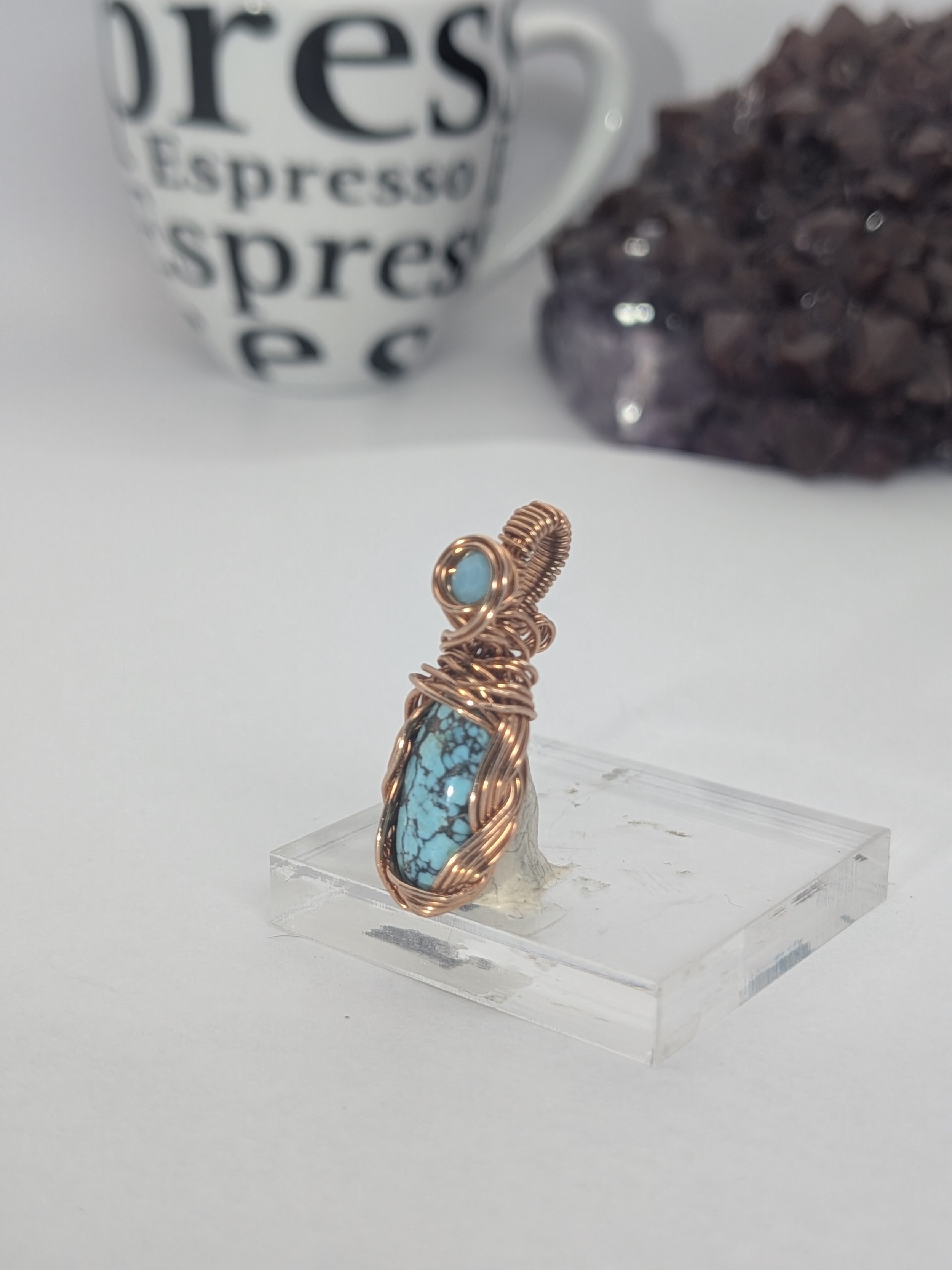 Gorgeous petite gemstone pendant, intricately wire-wrapped and accented with a heart-style bail, beautifully highlighting the stone as the centrepiece.