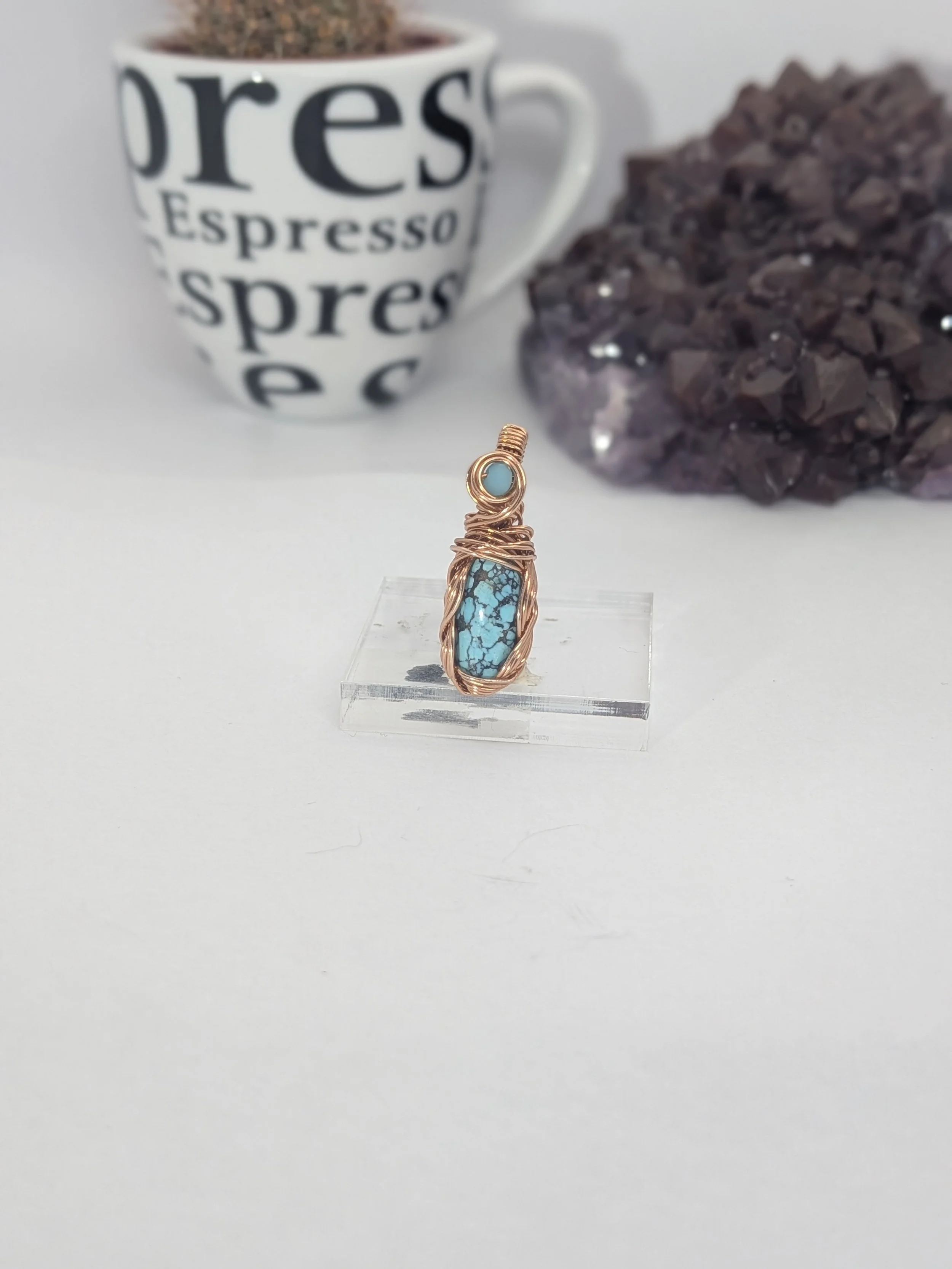 Gorgeous petite gemstone pendant, intricately wire-wrapped and accented with a heart-style bail, beautifully highlighting the stone as the centrepiece.