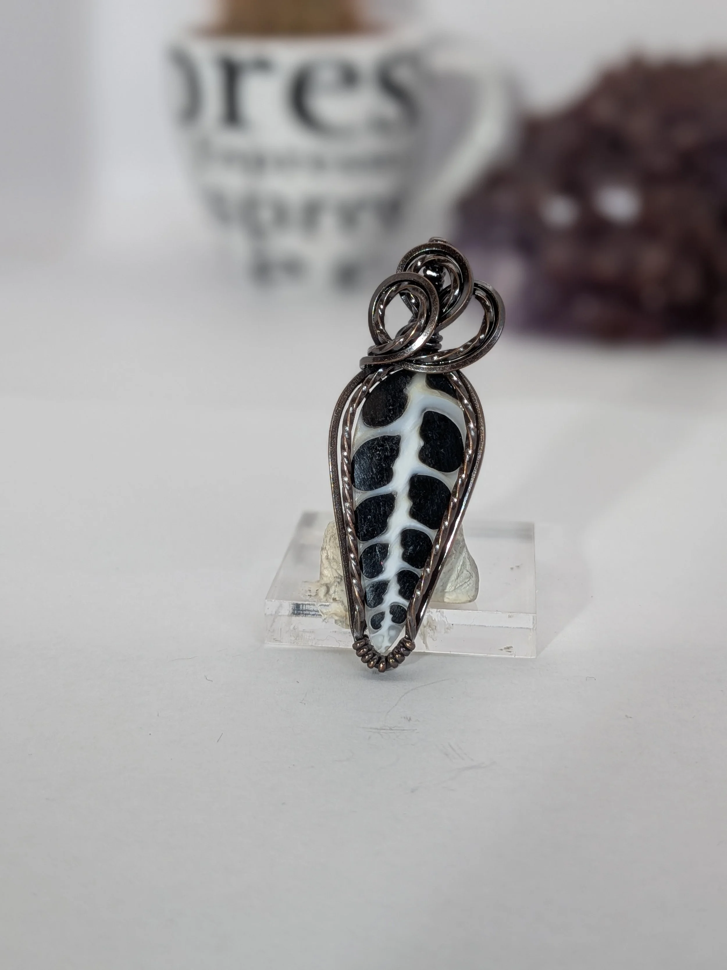 Gorgeous petite gemstone pendant, intricately wire-wrapped and accented with a heart-style bail, beautifully highlighting the stone as the centrepiece.