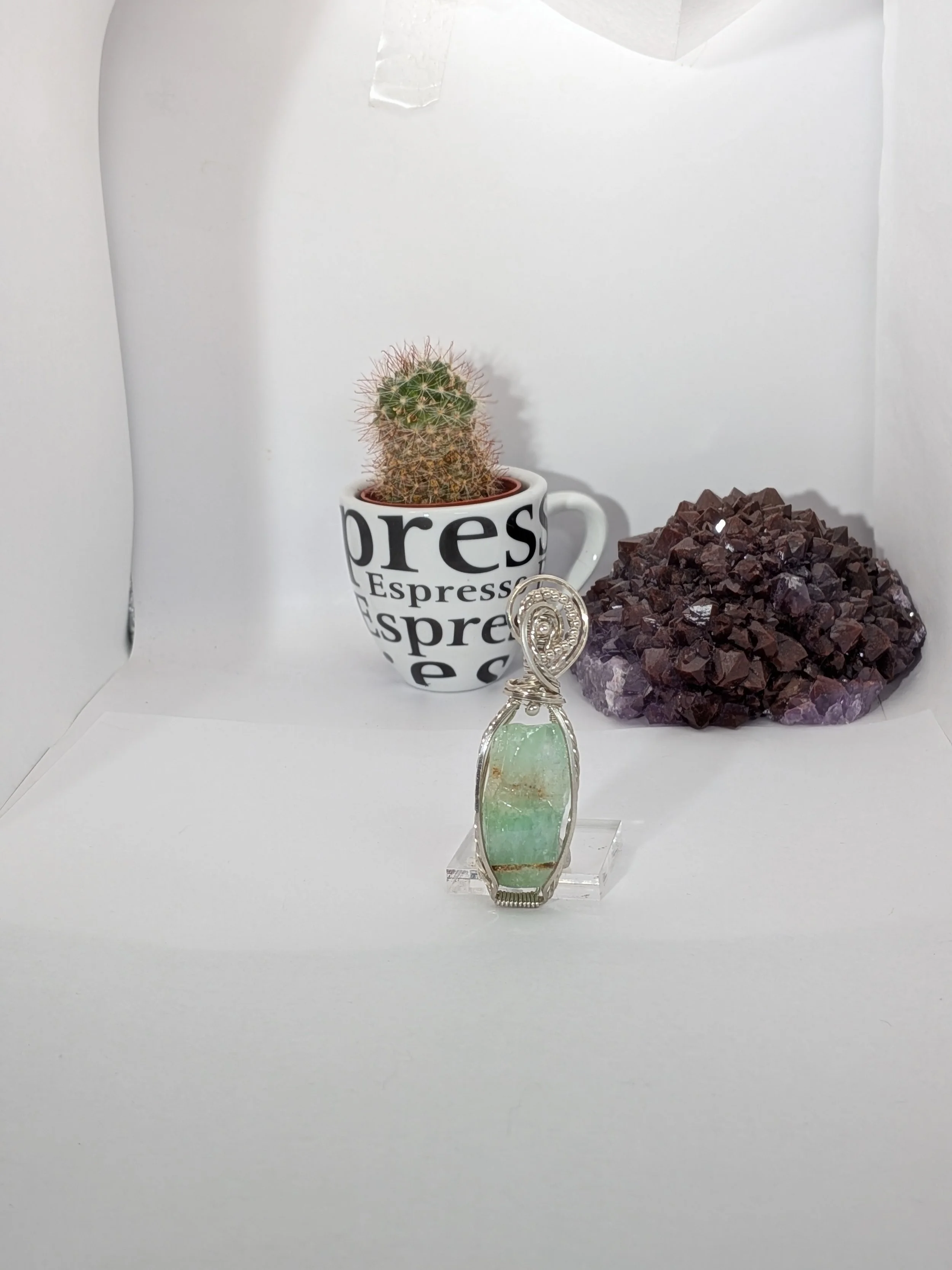 Sterling silver wire wrapped large green calcite gemstone, adorned with small silver beads for an elegant finish.