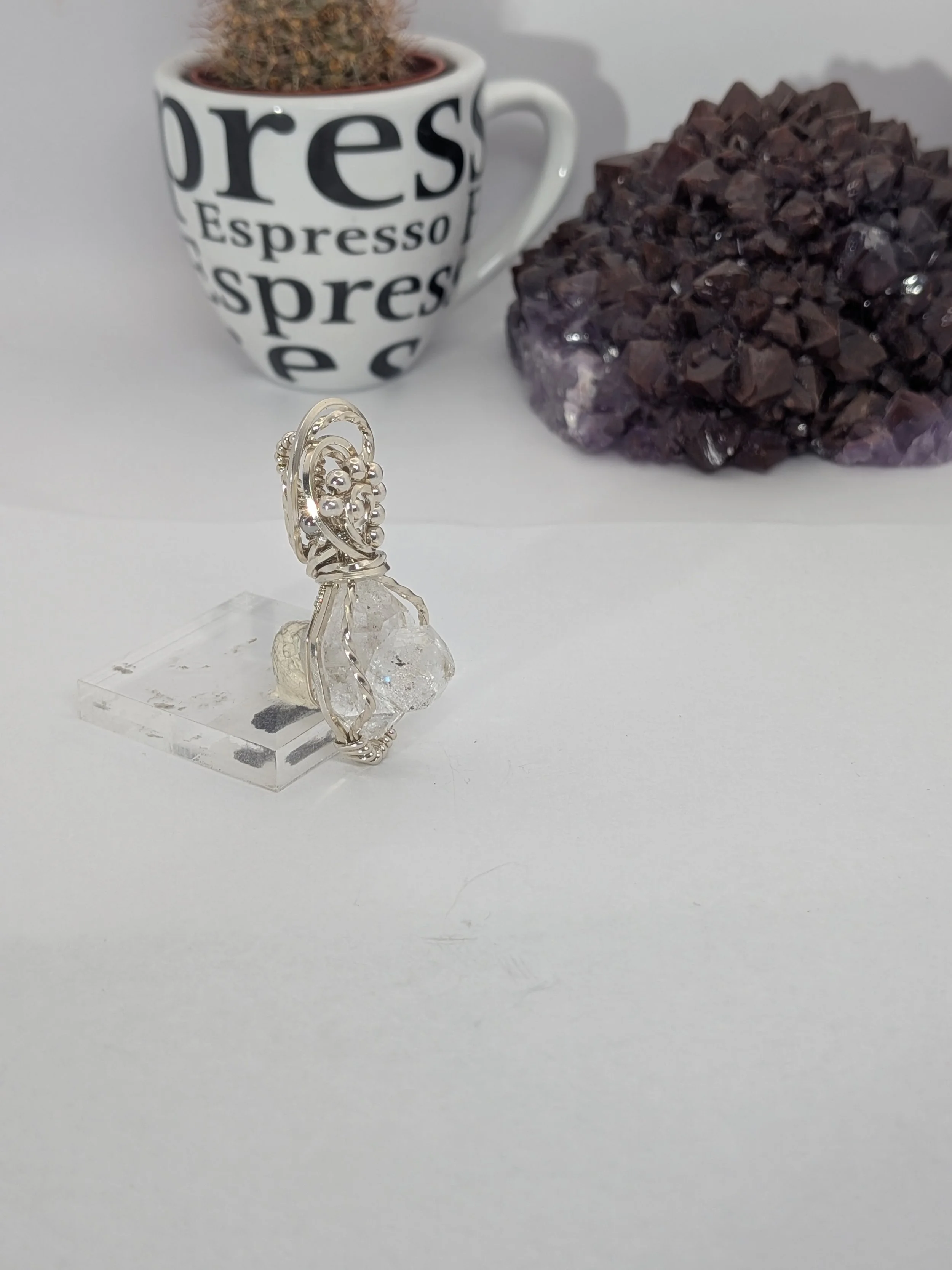 Extra large Herkimer diamond wrapped in antiqued sterling silver wire features an elegant wavy wire bail, with wire twisting and cascading down both sides of the diamond.