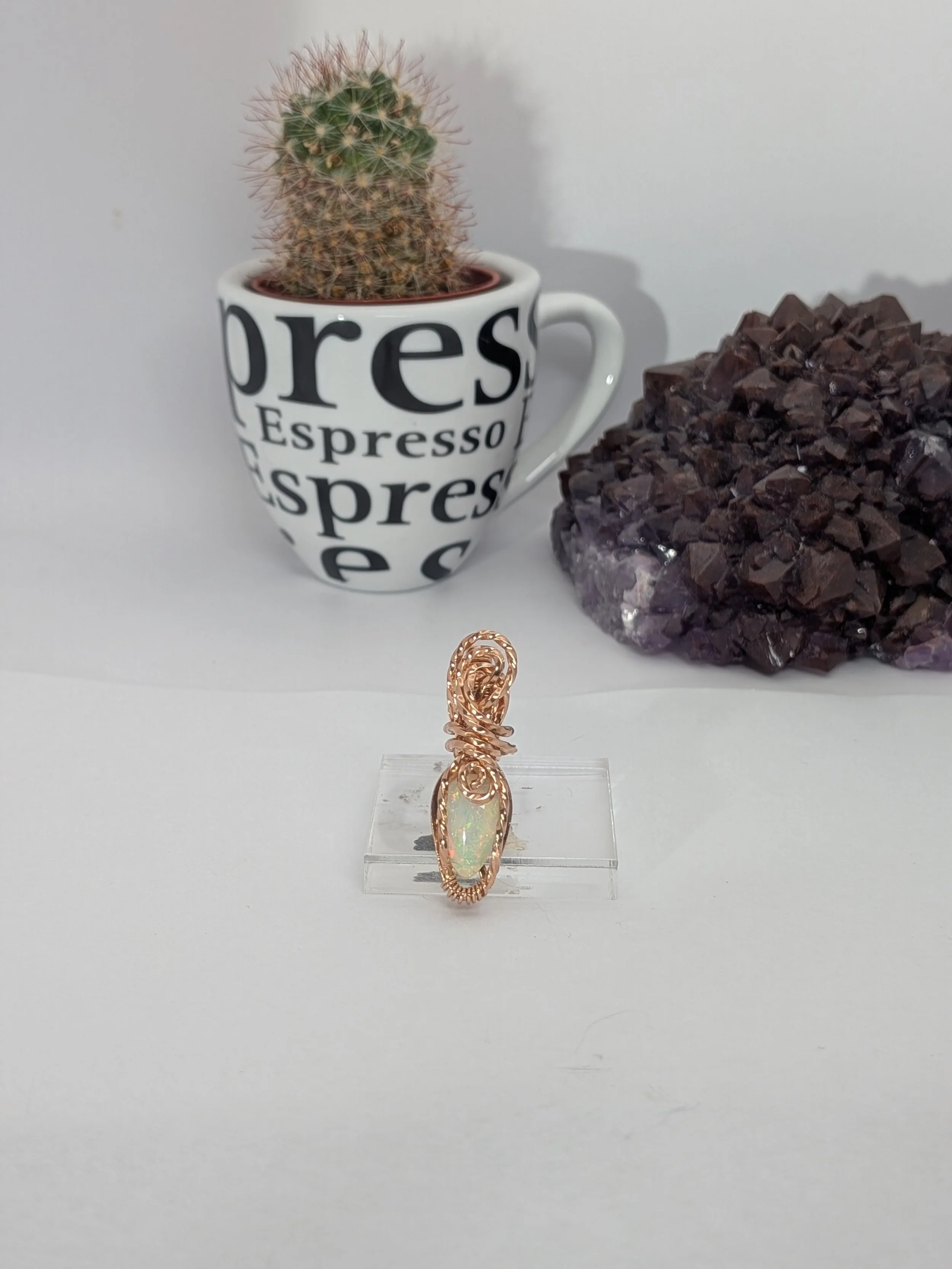 Gorgeous petite gemstone pendant, intricately wire-wrapped and accented with a heart-style bail, beautifully highlighting the stone as the centrepiece.