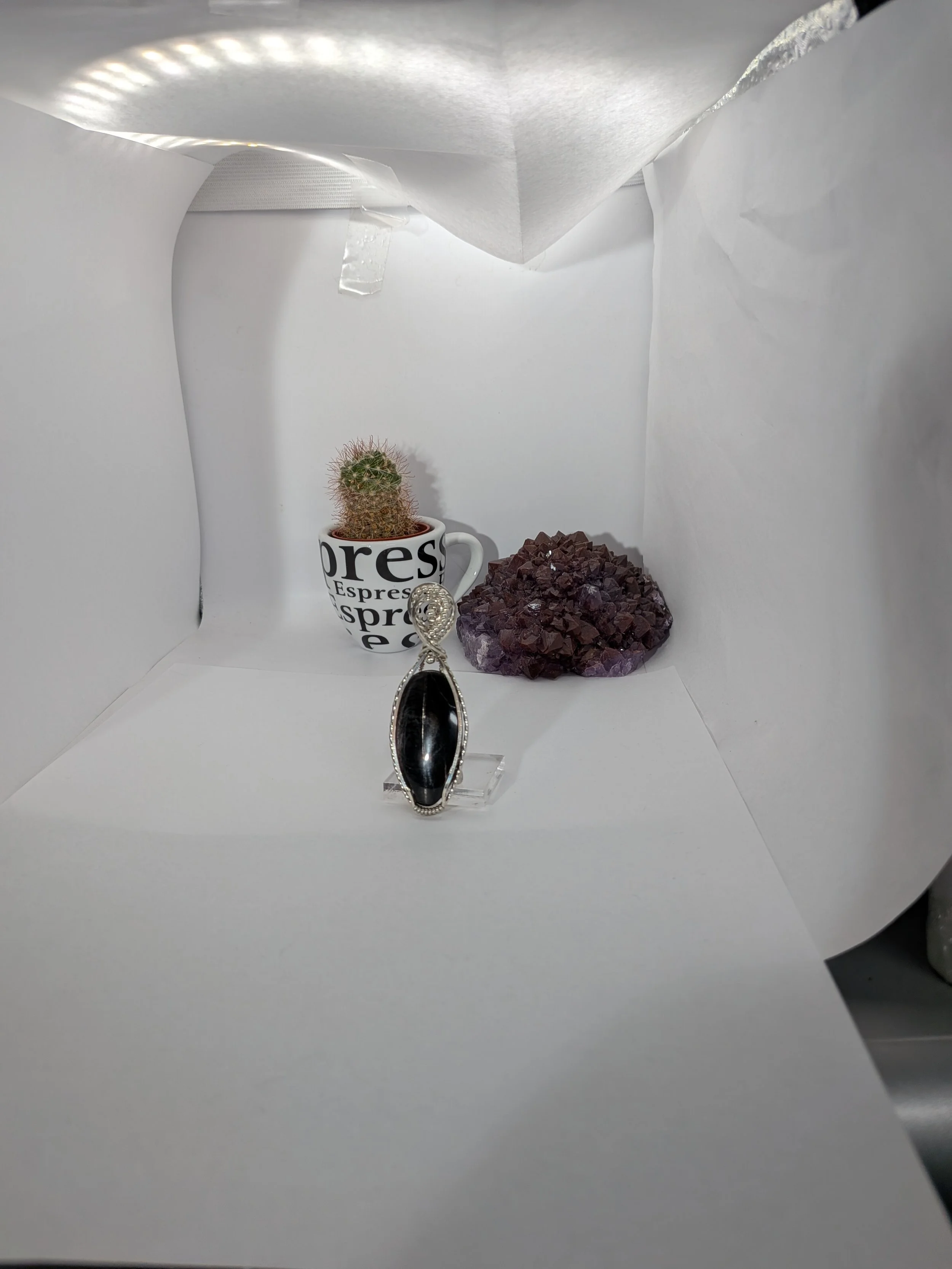 Gorgeous petite gemstone pendant, intricately wire-wrapped and accented with a heart-style bail, beautifully highlighting the stone as the centrepiece.