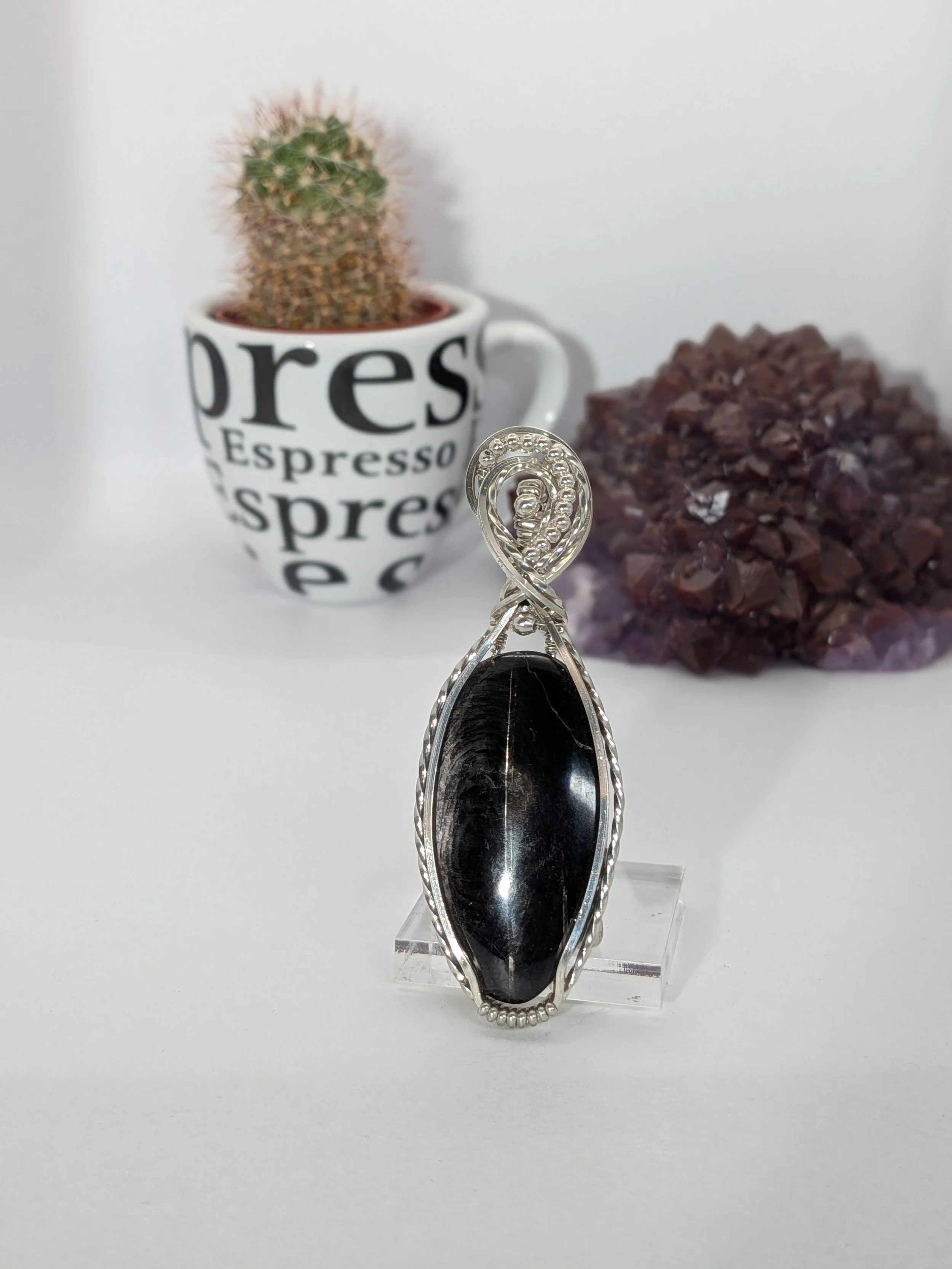 Gorgeous petite gemstone pendant, intricately wire-wrapped and accented with a heart-style bail, beautifully highlighting the stone as the centrepiece.