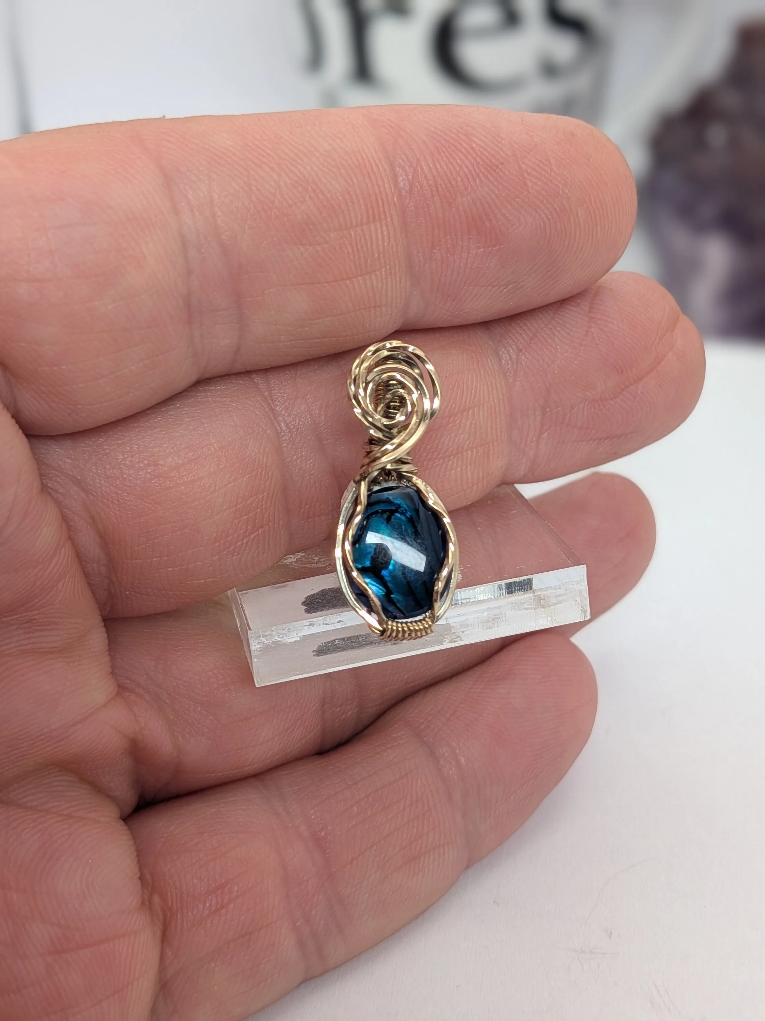 Gorgeous petite gemstone pendant, intricately wire-wrapped and accented with a heart-style bail, beautifully highlighting the stone as the centrepiece.