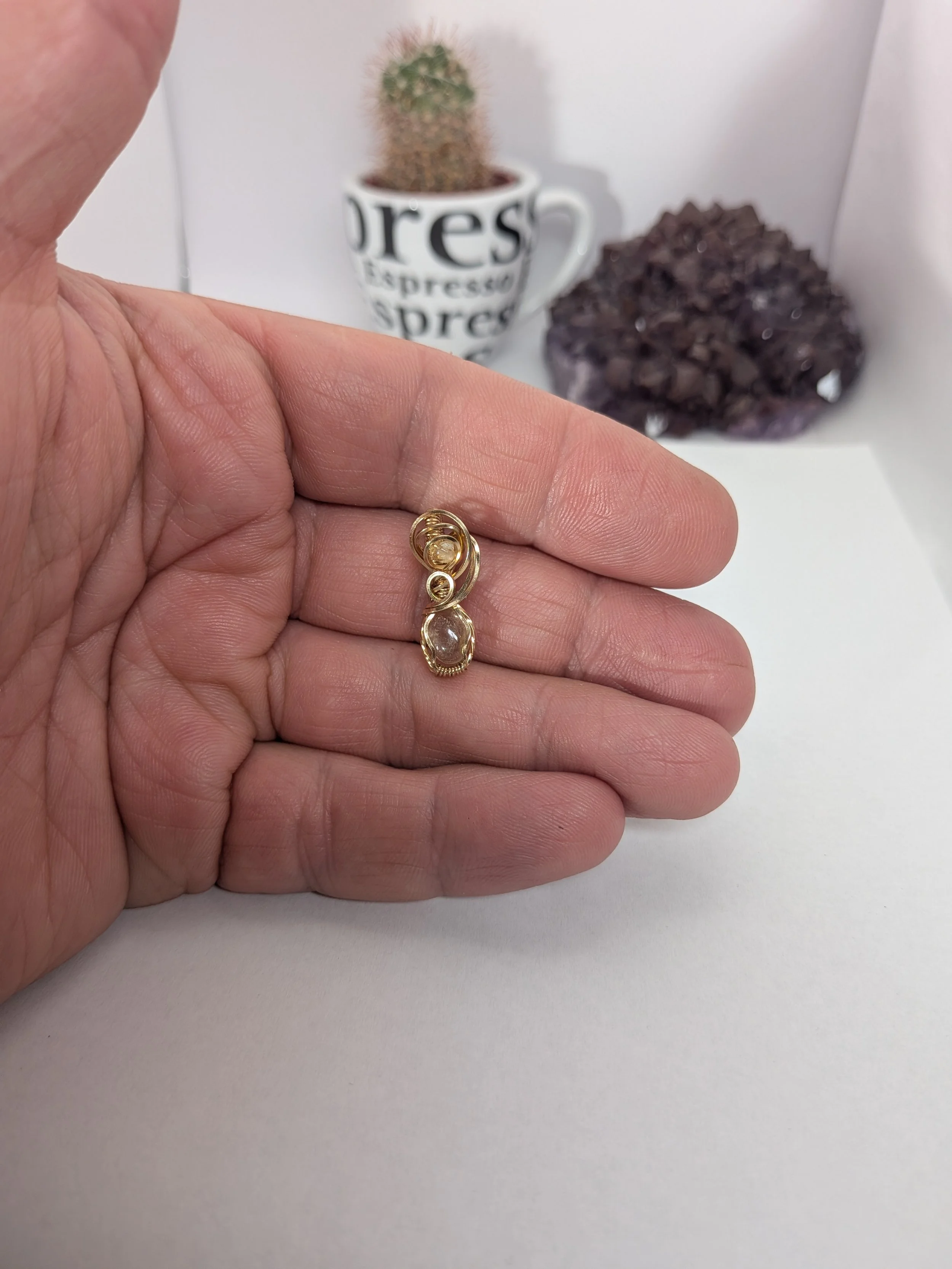 Gorgeous petite gemstone pendant, intricately wire-wrapped and accented with a heart-style bail, beautifully highlighting the stone as the centrepiece.