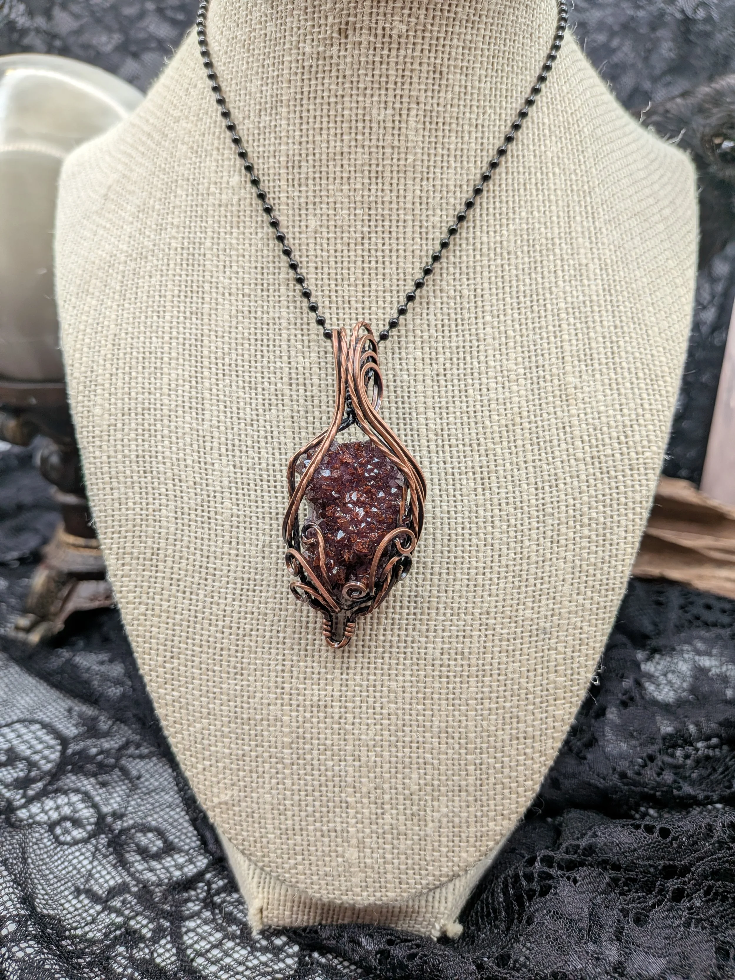 A stunning Thunder Bay amethyst cluster wrapped in Viking copper wire, elegantly accented with wavy copper to highlight the amethyst as the focal point.jpg