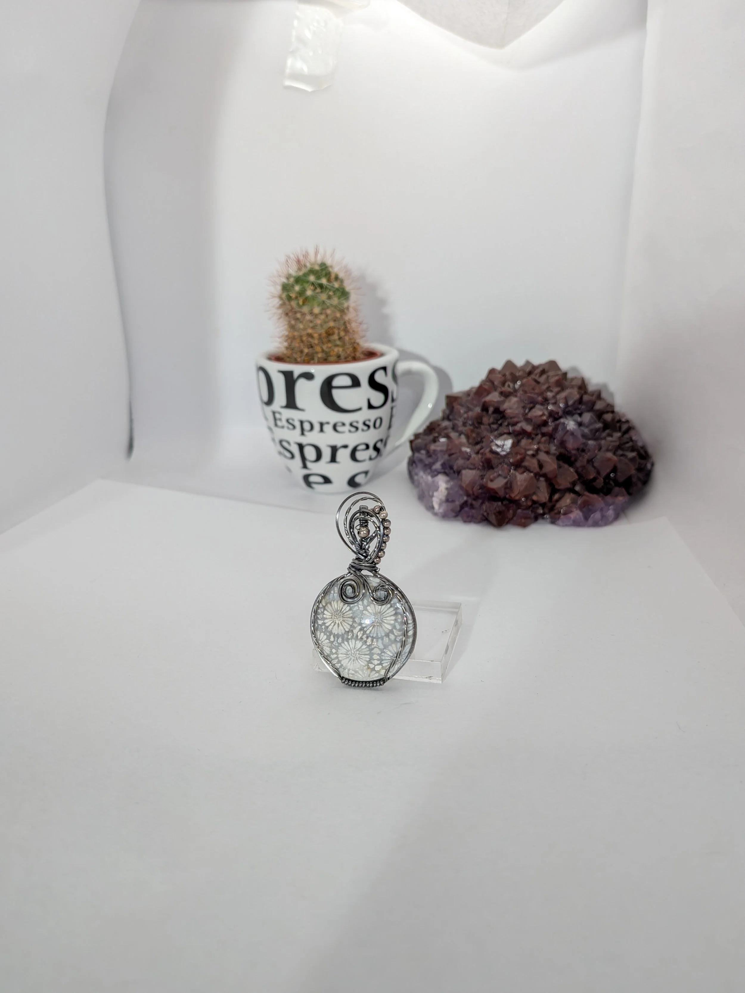 Gorgeous petite gemstone pendant, intricately wire-wrapped and accented with a heart-style bail, beautifully highlighting the stone as the centrepiece.