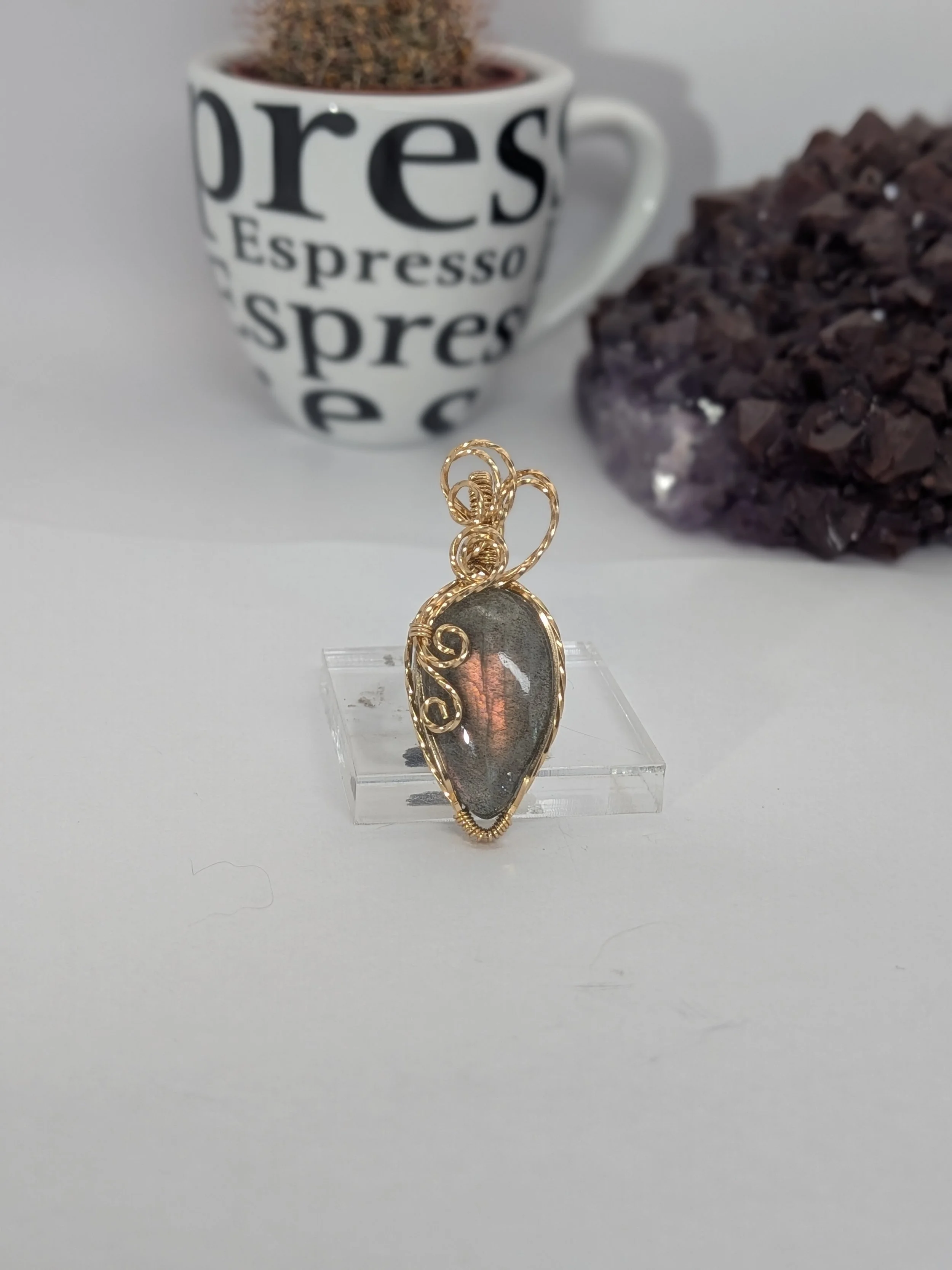 Gorgeous petite labradorite pendant, intricately wire-wrapped and accented with a heart-style bail, beautifully highlighting the stone as the centrepiece.