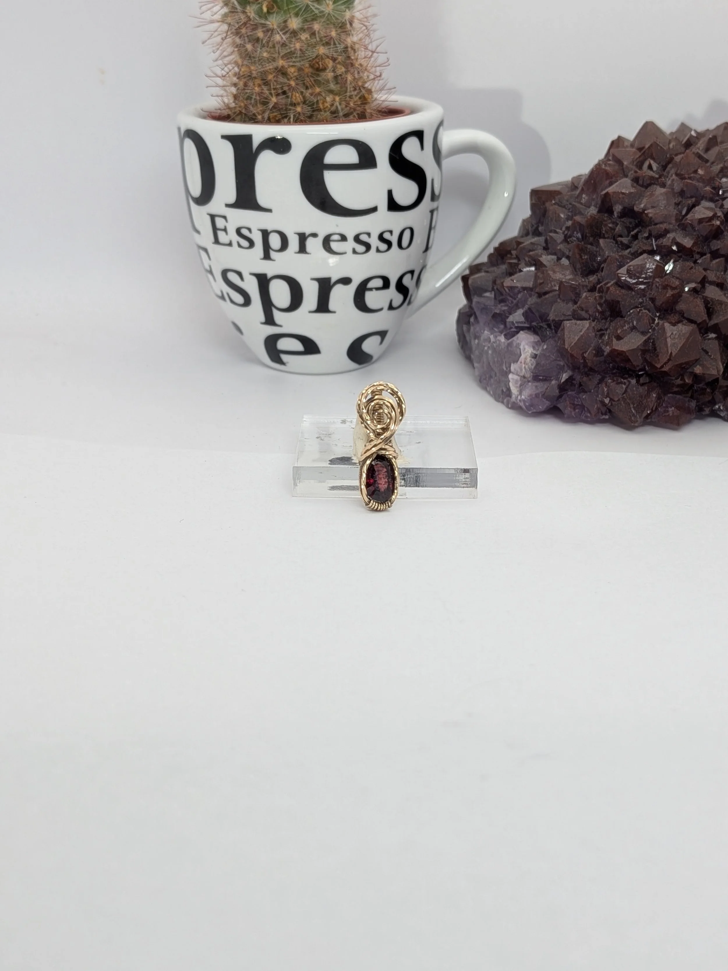 Gorgeous petite gemstone pendant, intricately wire-wrapped and accented with a heart-style bail, beautifully highlighting the stone as the centrepiece.