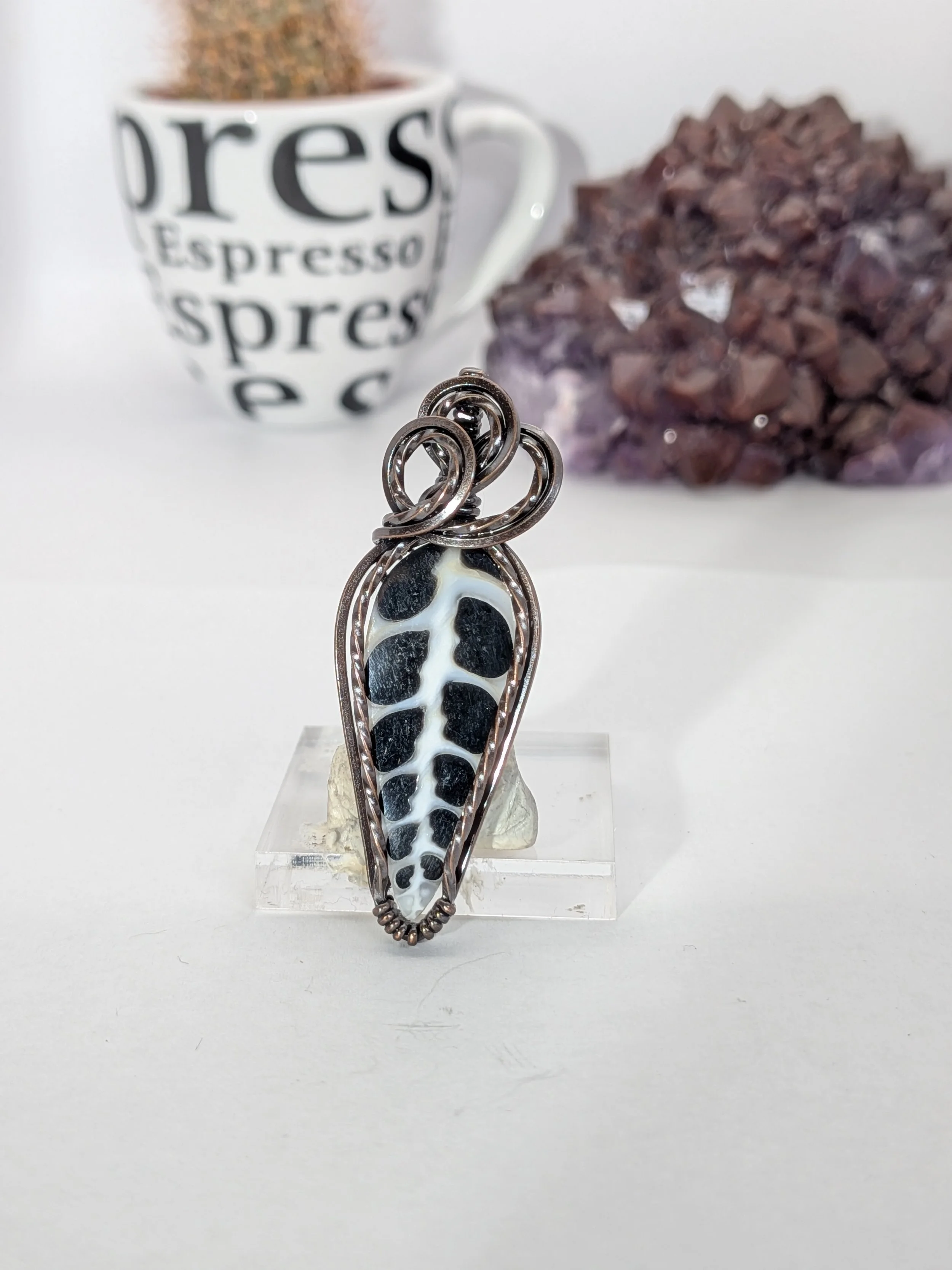 Gorgeous petite gemstone pendant, intricately wire-wrapped and accented with a heart-style bail, beautifully highlighting the stone as the centrepiece.