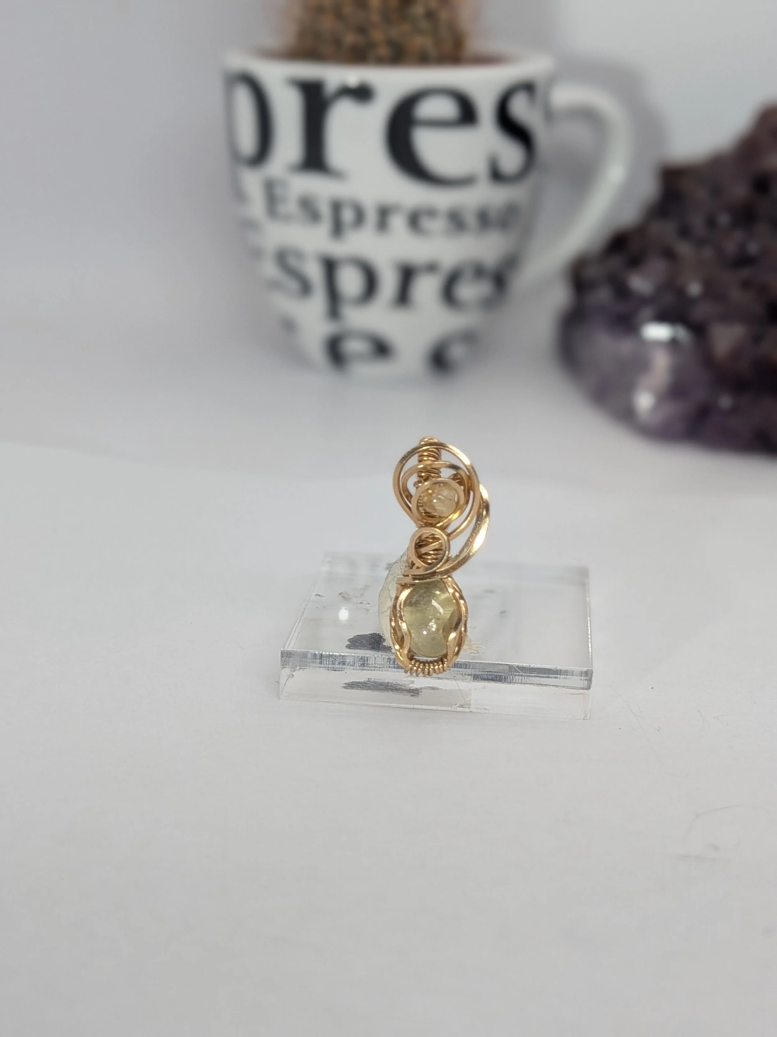 Gorgeous petite gemstone pendant, intricately wire-wrapped and accented with a heart-style bail, beautifully highlighting the stone as the centrepiece.