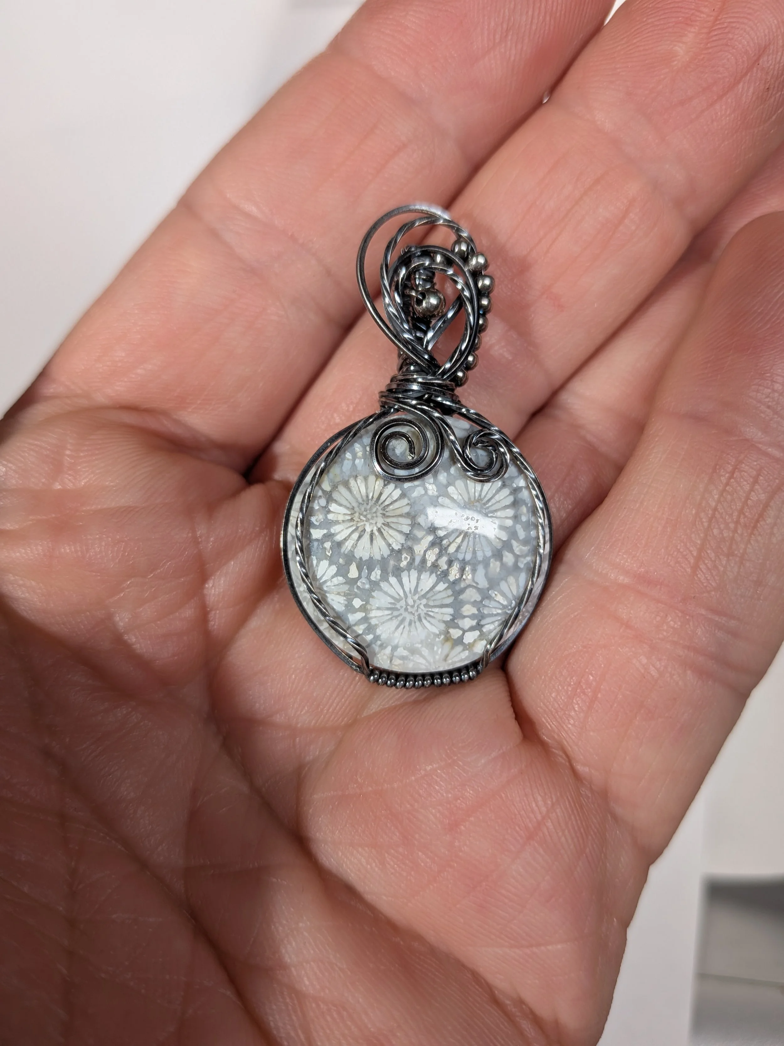 Gorgeous petite gemstone pendant, intricately wire-wrapped and accented with a heart-style bail, beautifully highlighting the stone as the centrepiece.